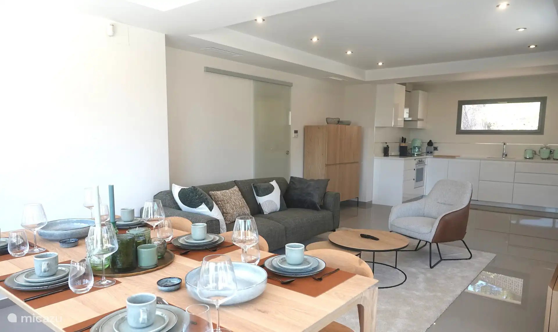 the beautiful modern living-dining room with luxury kitchen