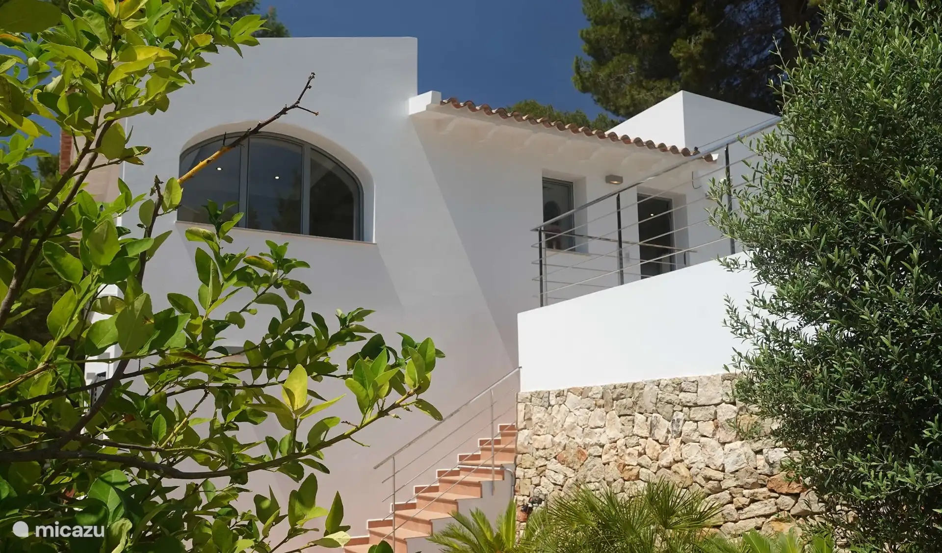 The villa seen from the covered terrace