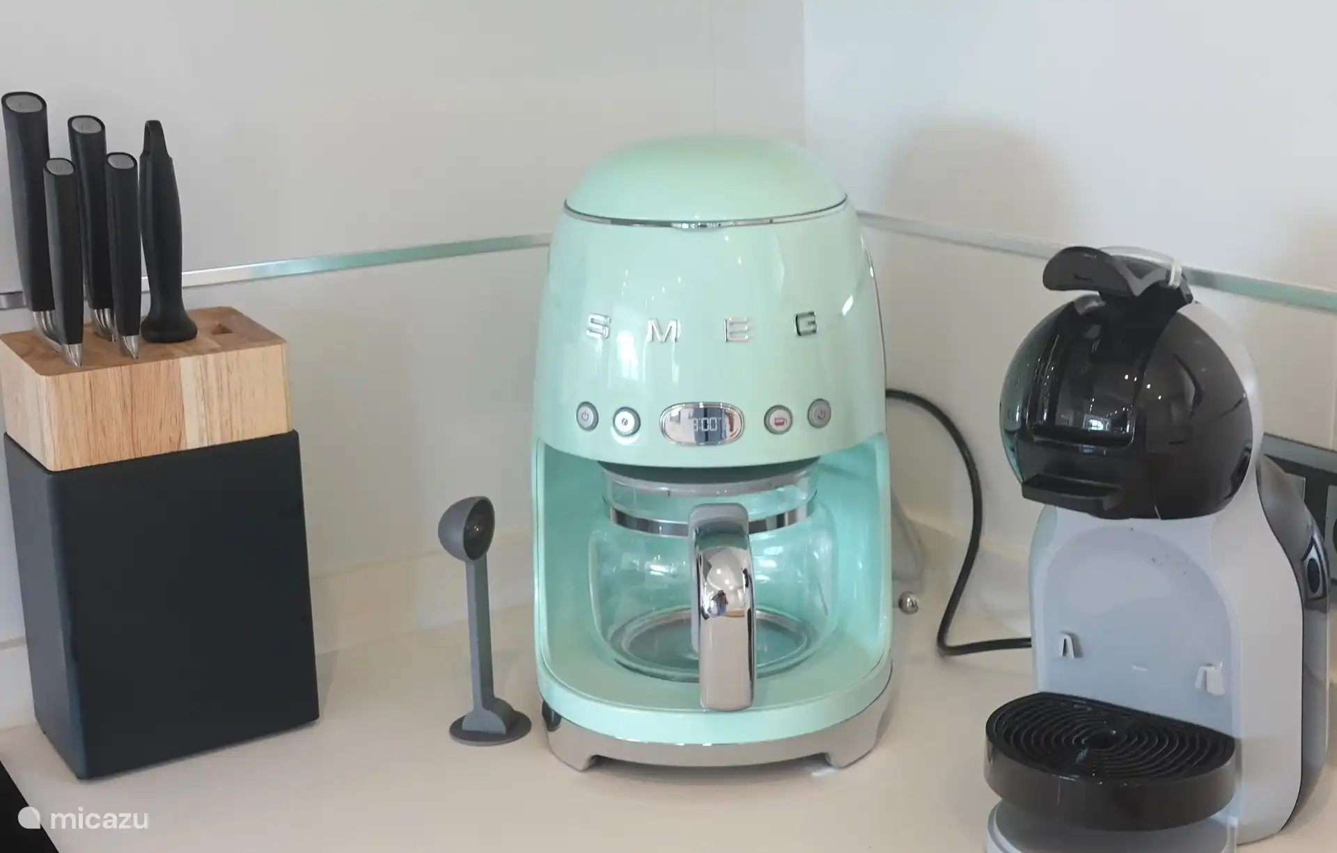The kitchen is equipped with luxury appliances
