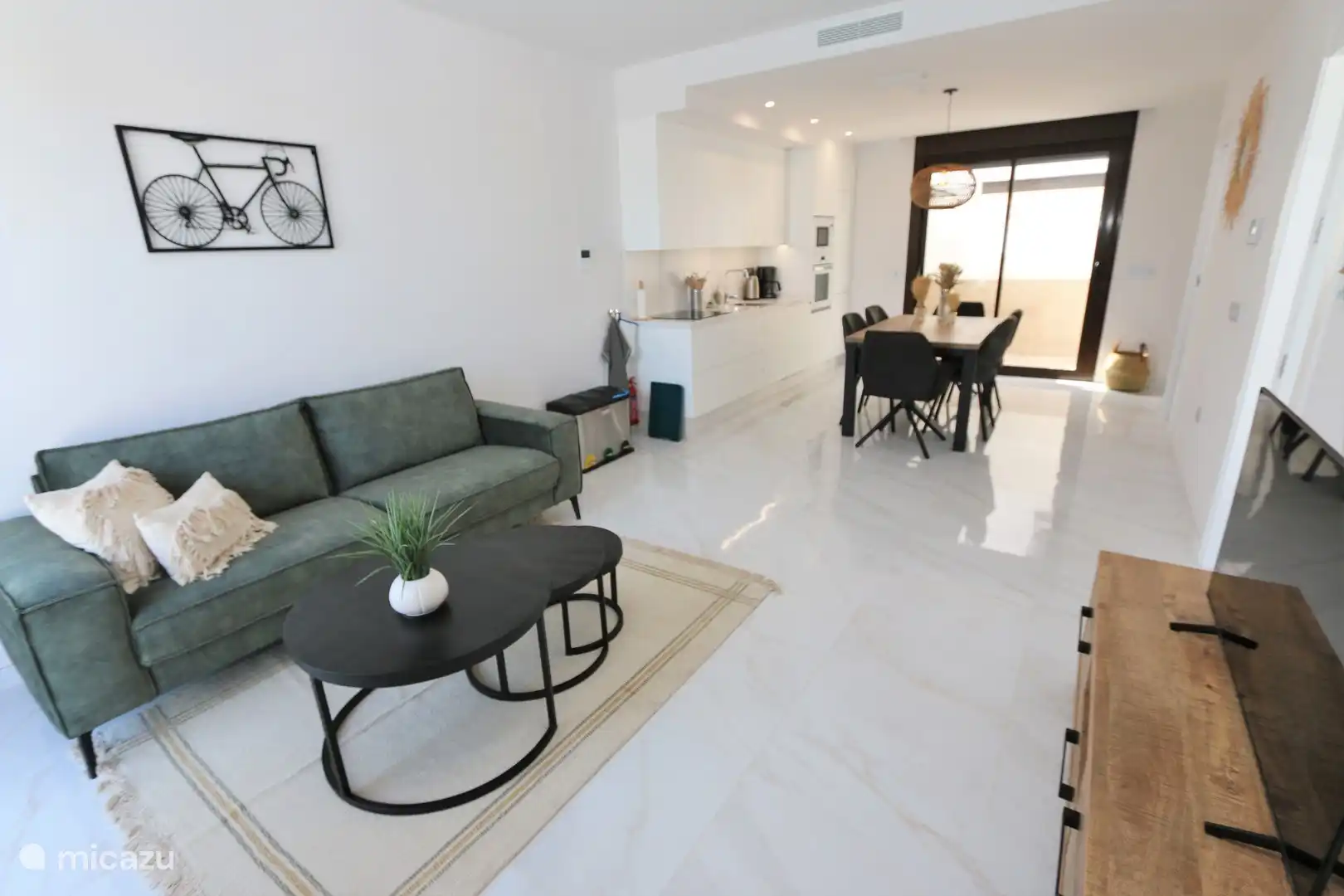 Living room, dining table and kitchen