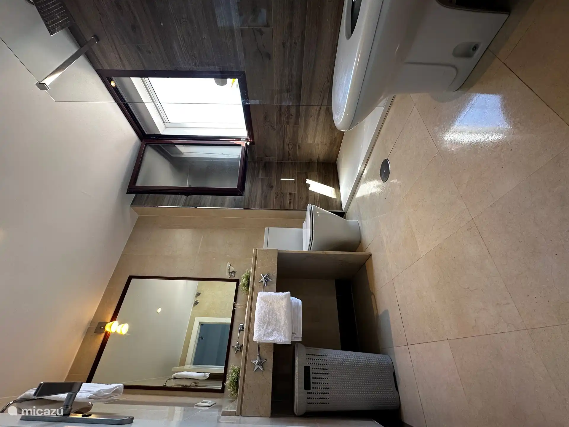 This bathroom belongs to the master bedroom, with walk-in shower and bidet.