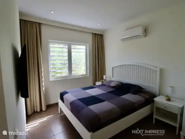 The Ultimate Caribbean Experience | Curaçao, Curaçao-Centre, Sint Michiel - appartement Chambre avec lit double, TV et armoire