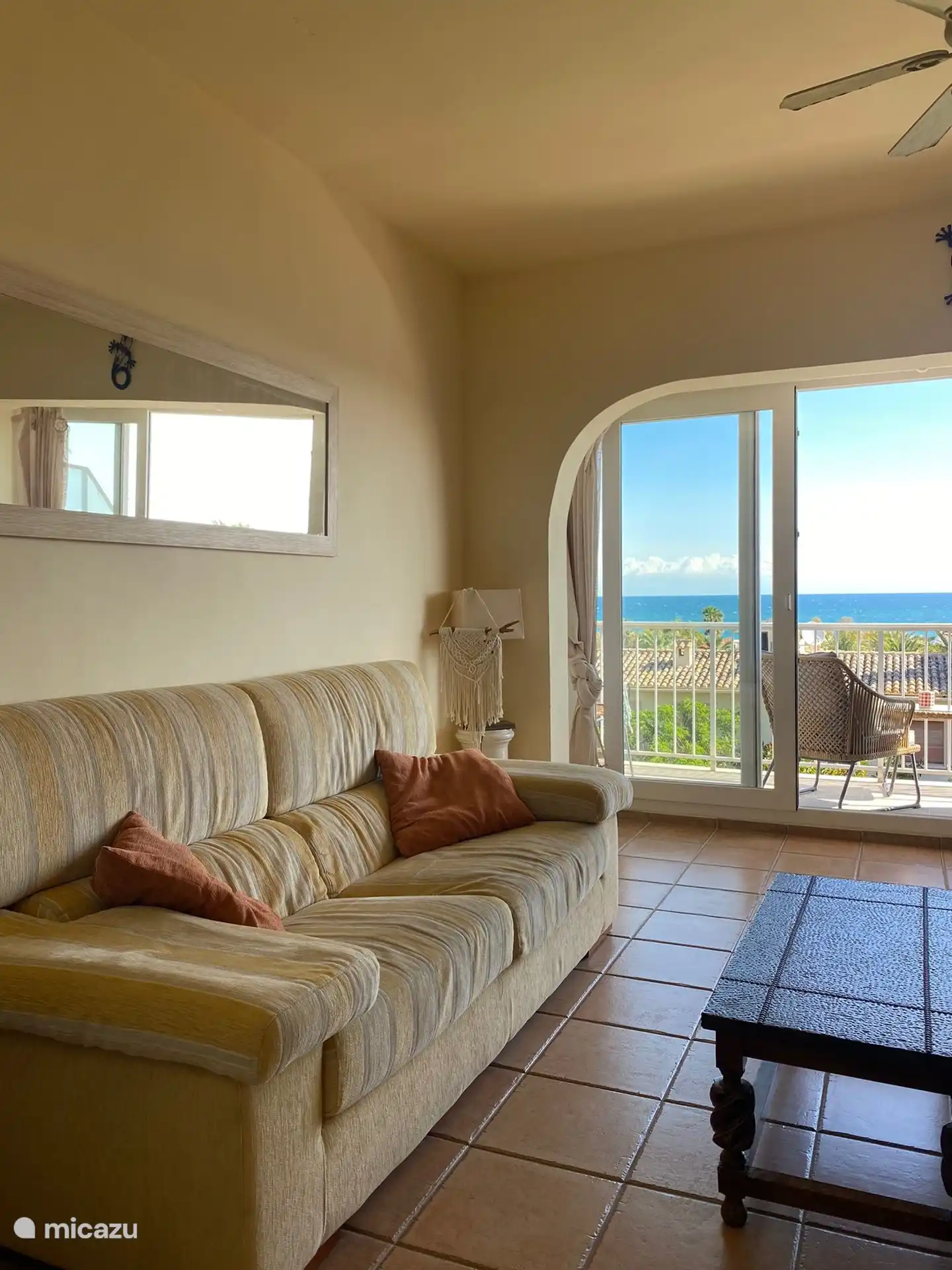 The comfortable living room space with fantastic views of the sea.