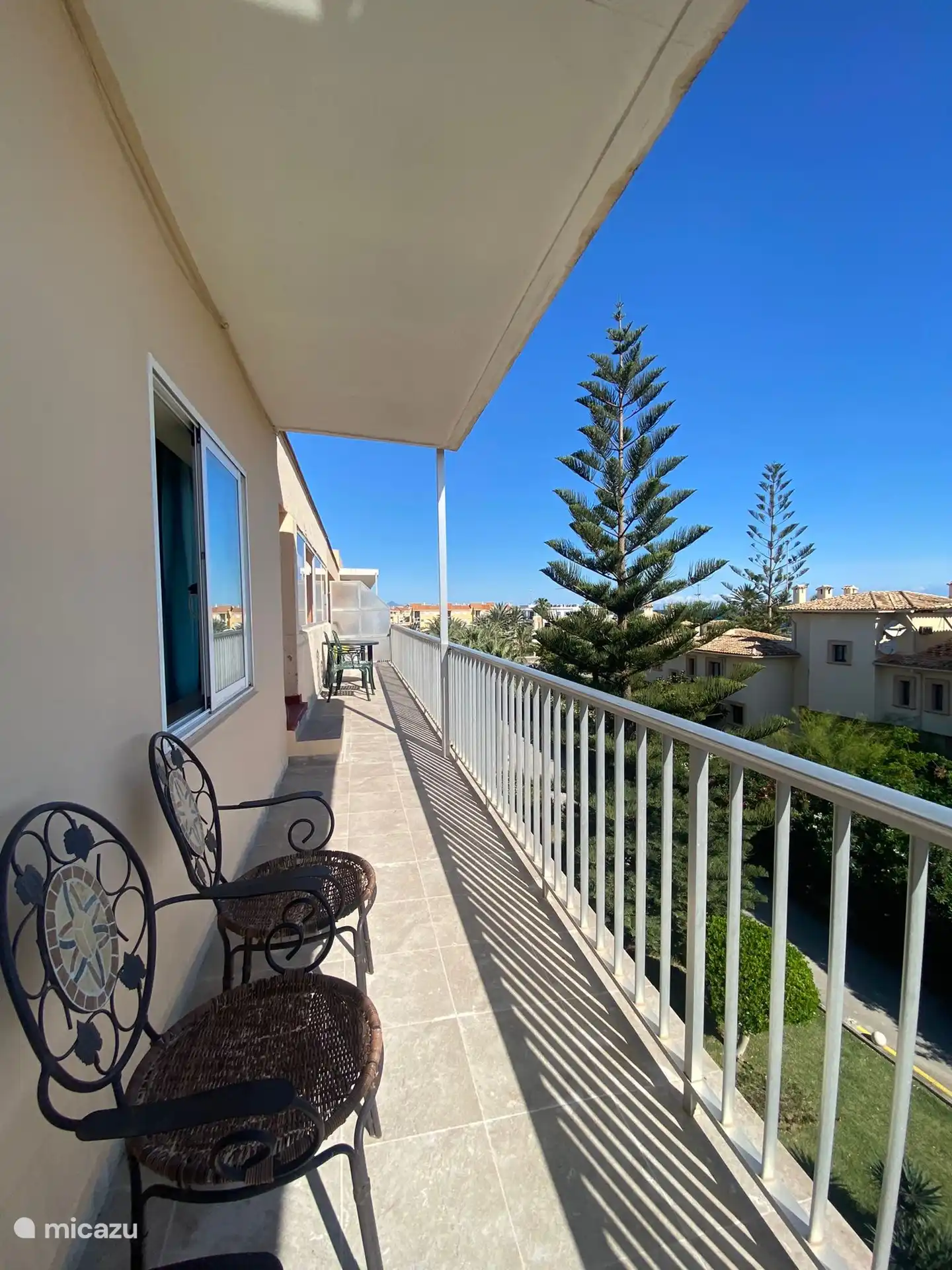 The front balcony leads to the large private roof terrace.