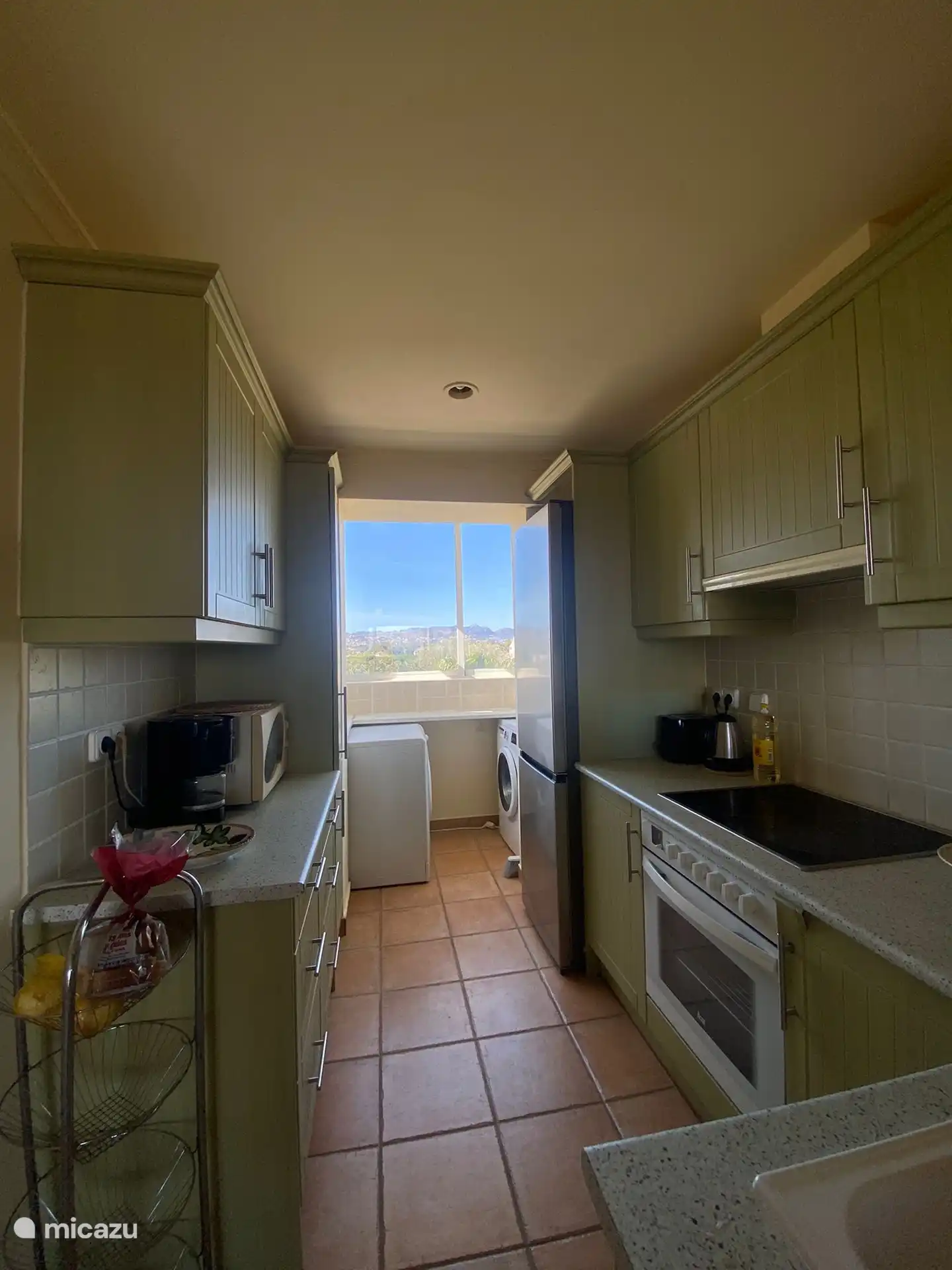 A small kitchen with all amenities you need.