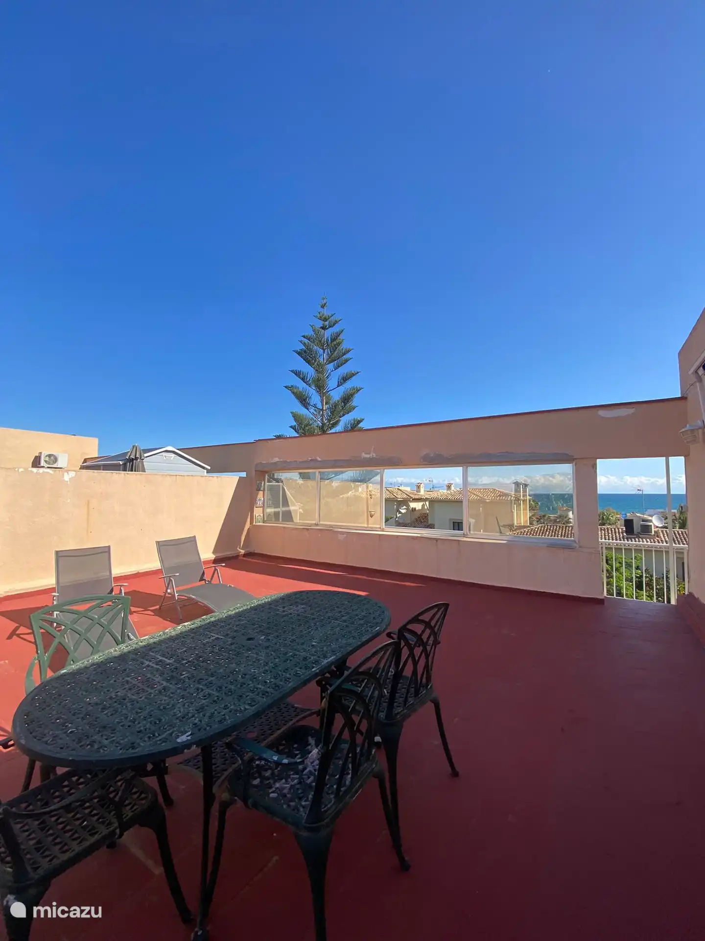 The roof terrace which offers lots of space for relaxing, having a barbeque, enjoying the views to the sea and the mountains.