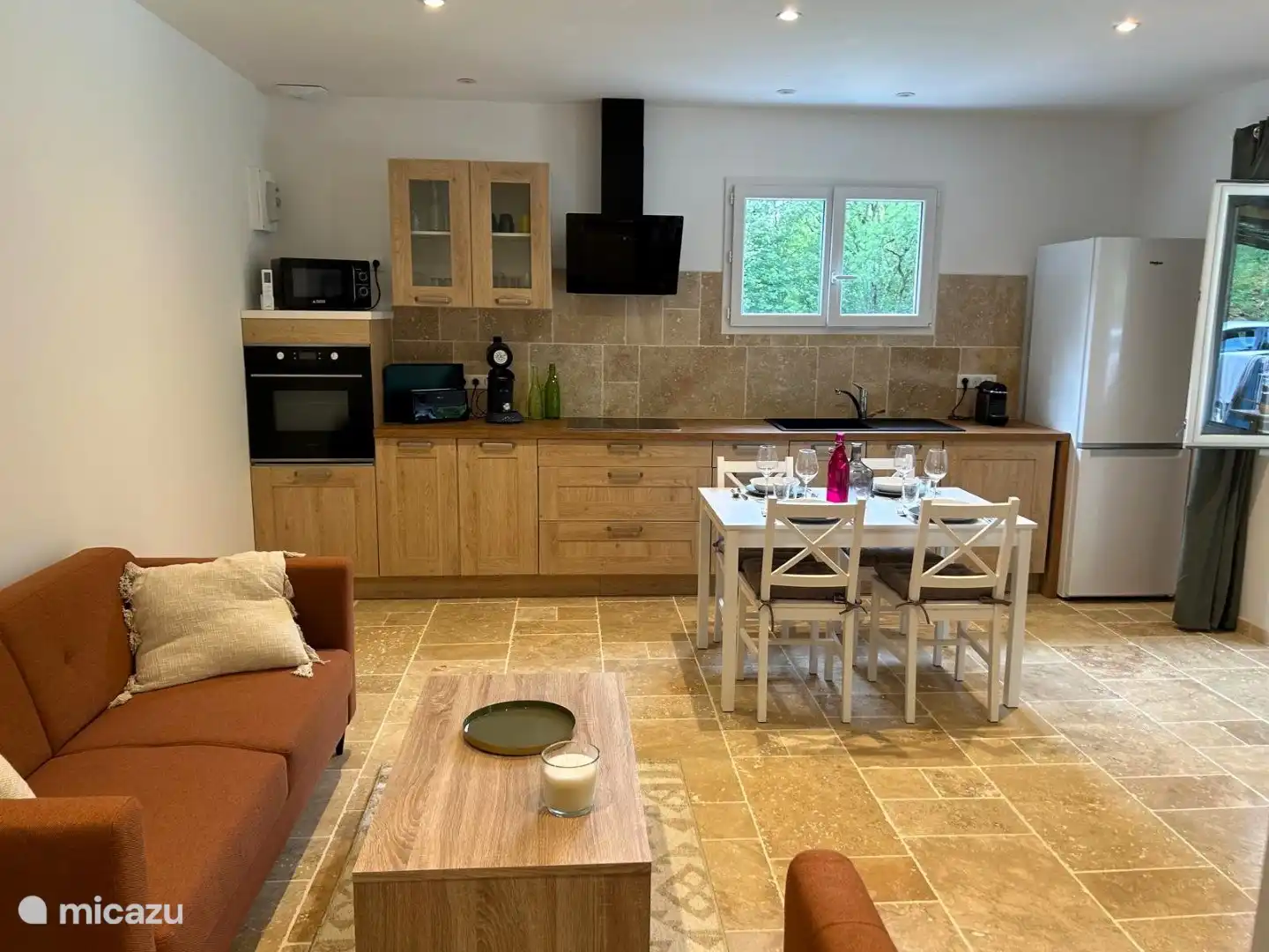 The living room with open kitchen