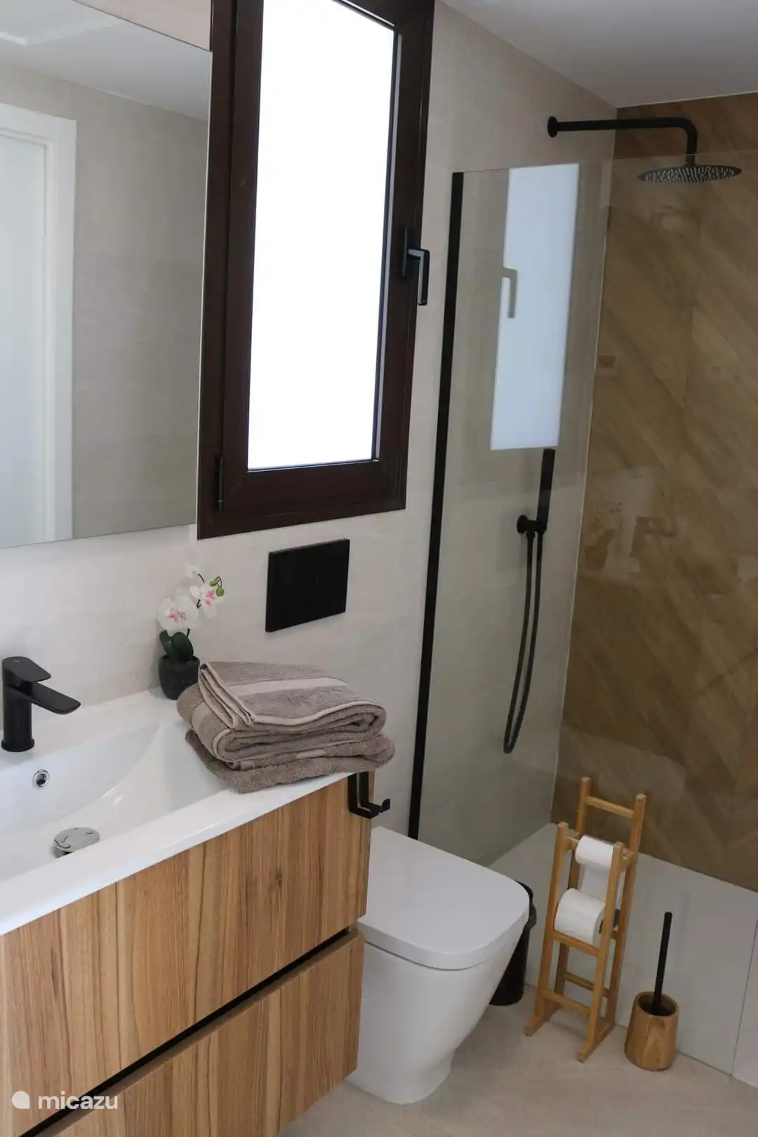 Two bathrooms with sink, shower and toilet