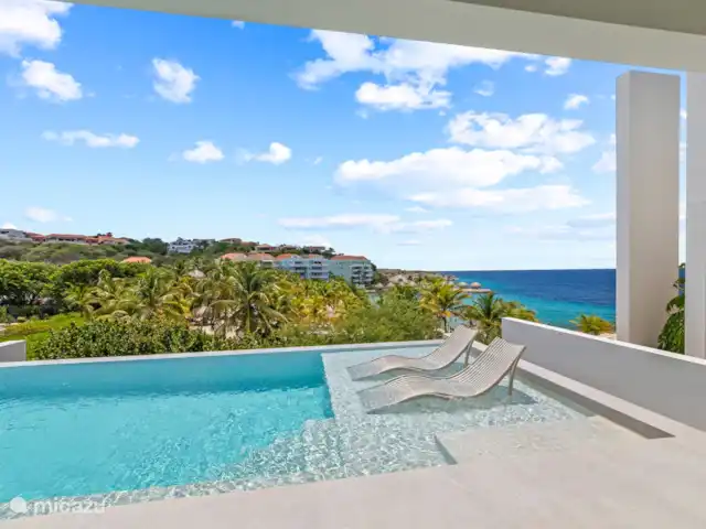 Station balnéaire de Blue Bay | Villa Bocazul 1 | Curaçao, Curaçao-Centre, Blue Bay - villa Chaises longues dans l’eau : détente ultime