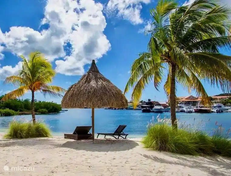 Private beach with sunbeds and a view over the Spanish Water.