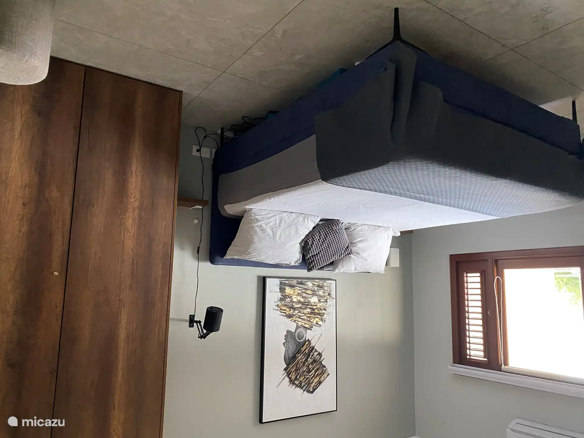 Large bedroom with large double bed and adjoining bathroom.