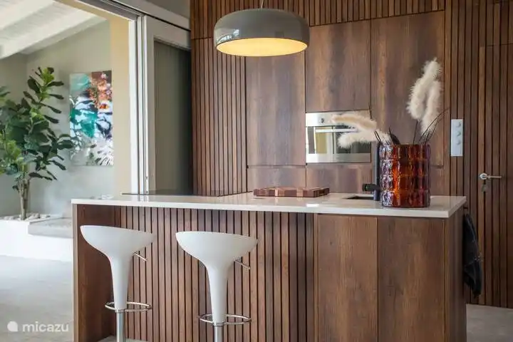 Open kitchen with all facilities and dining bar.