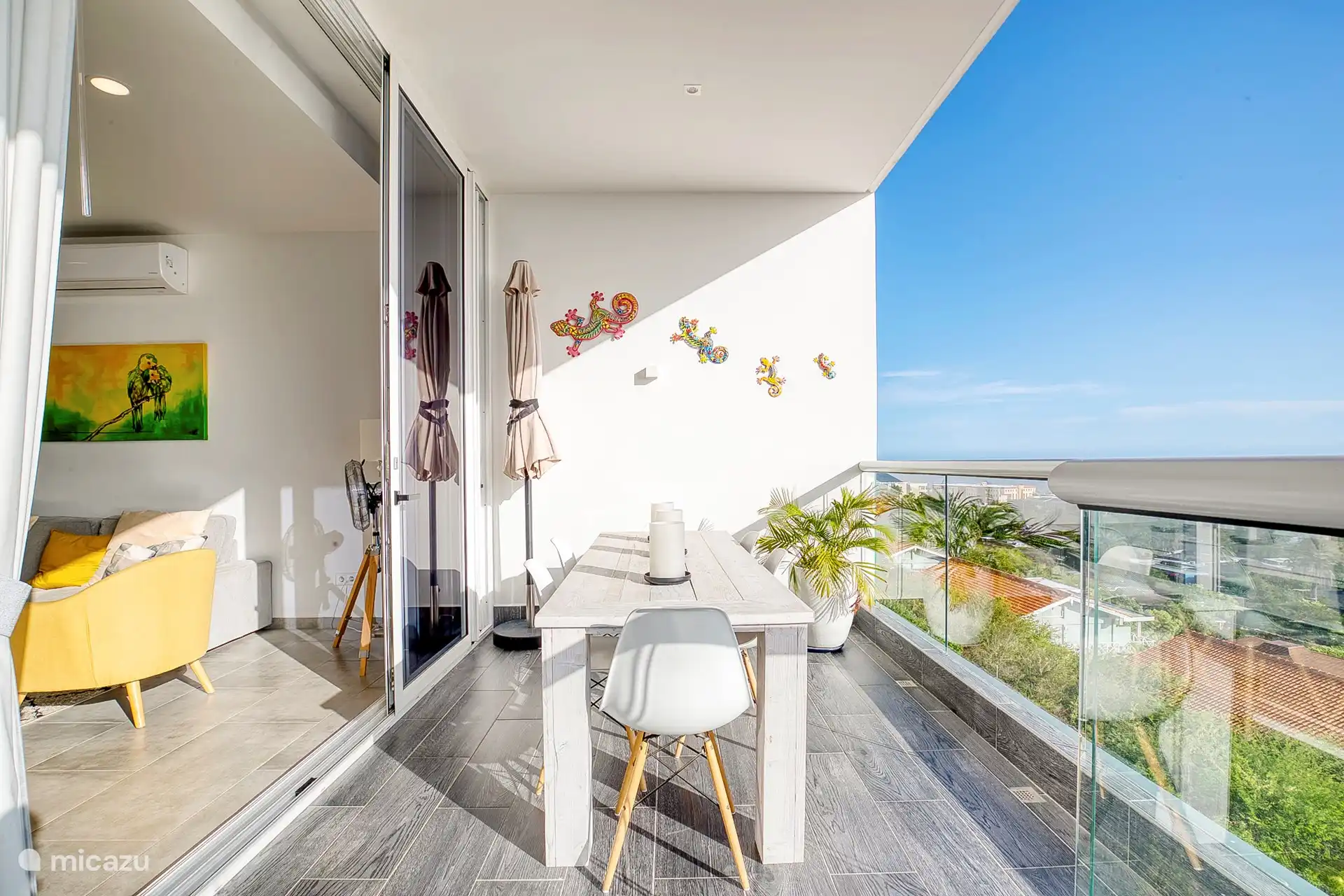 Opening the floor-to-ceiling doors extends the living room to the outdoors