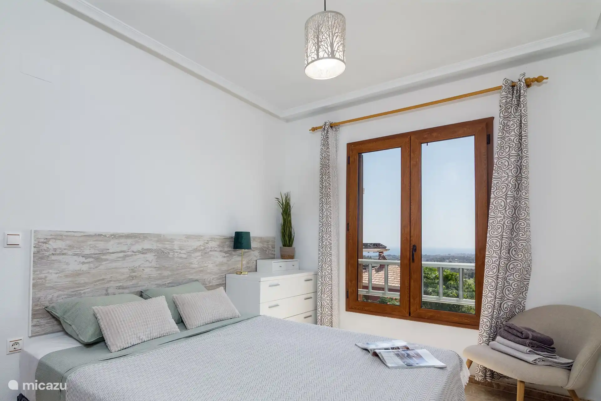 Wake up to breathtaking sea views in this bright and airy bedroom. Your perfect seaside escape starts here.