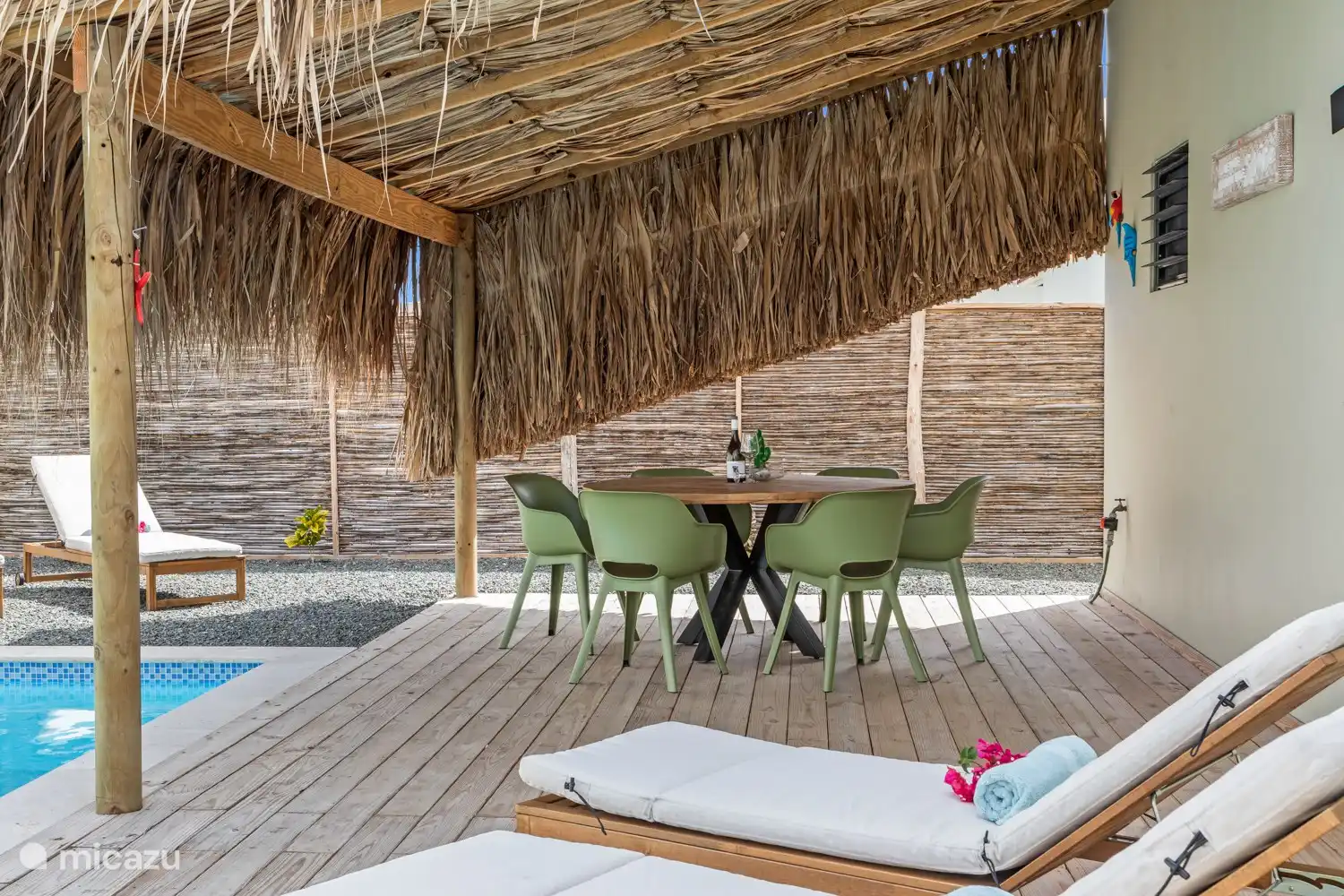 Outdoor dining area under the palapa