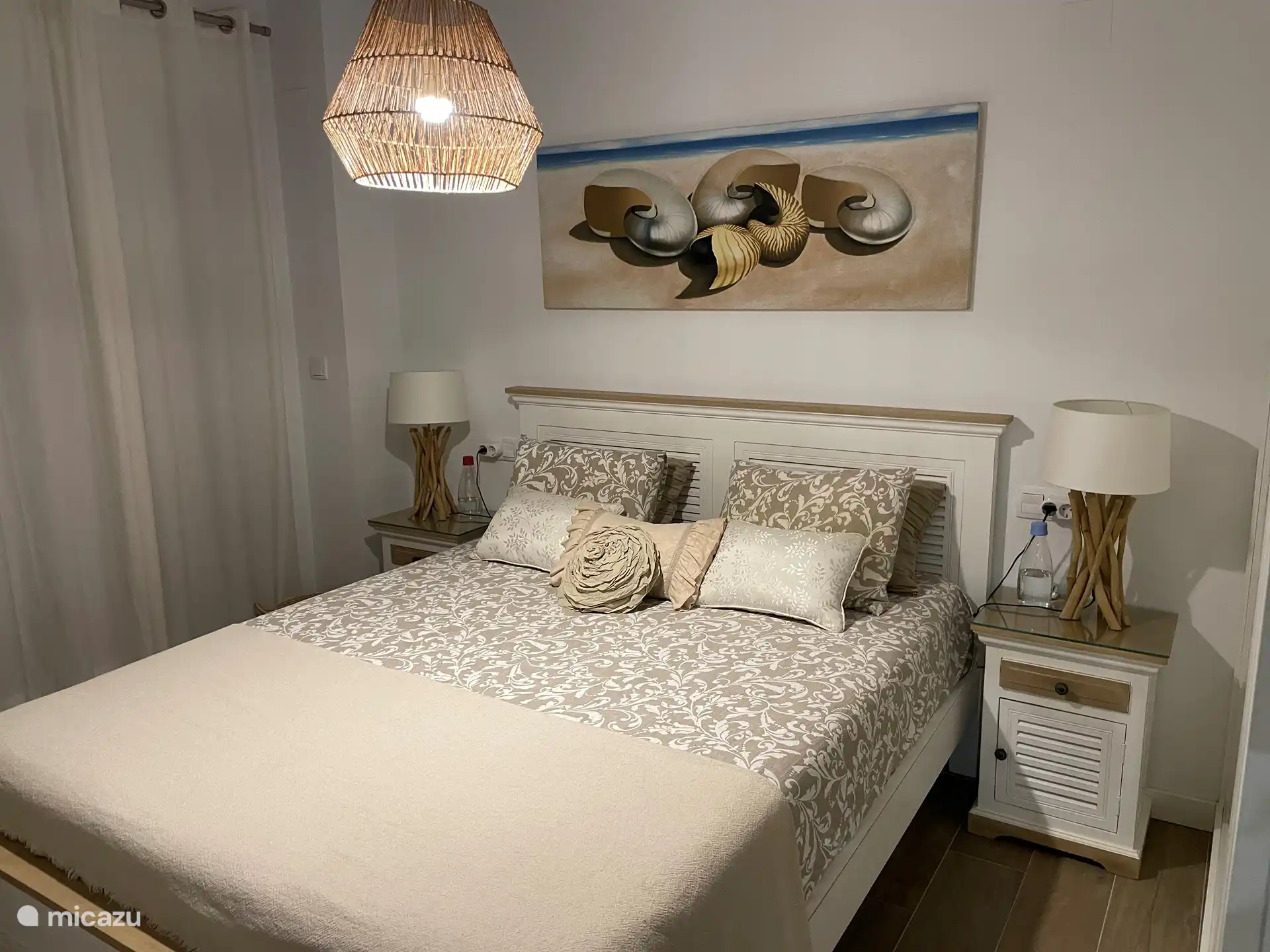 Bedroom with private bathroom and fitted wardrobe.