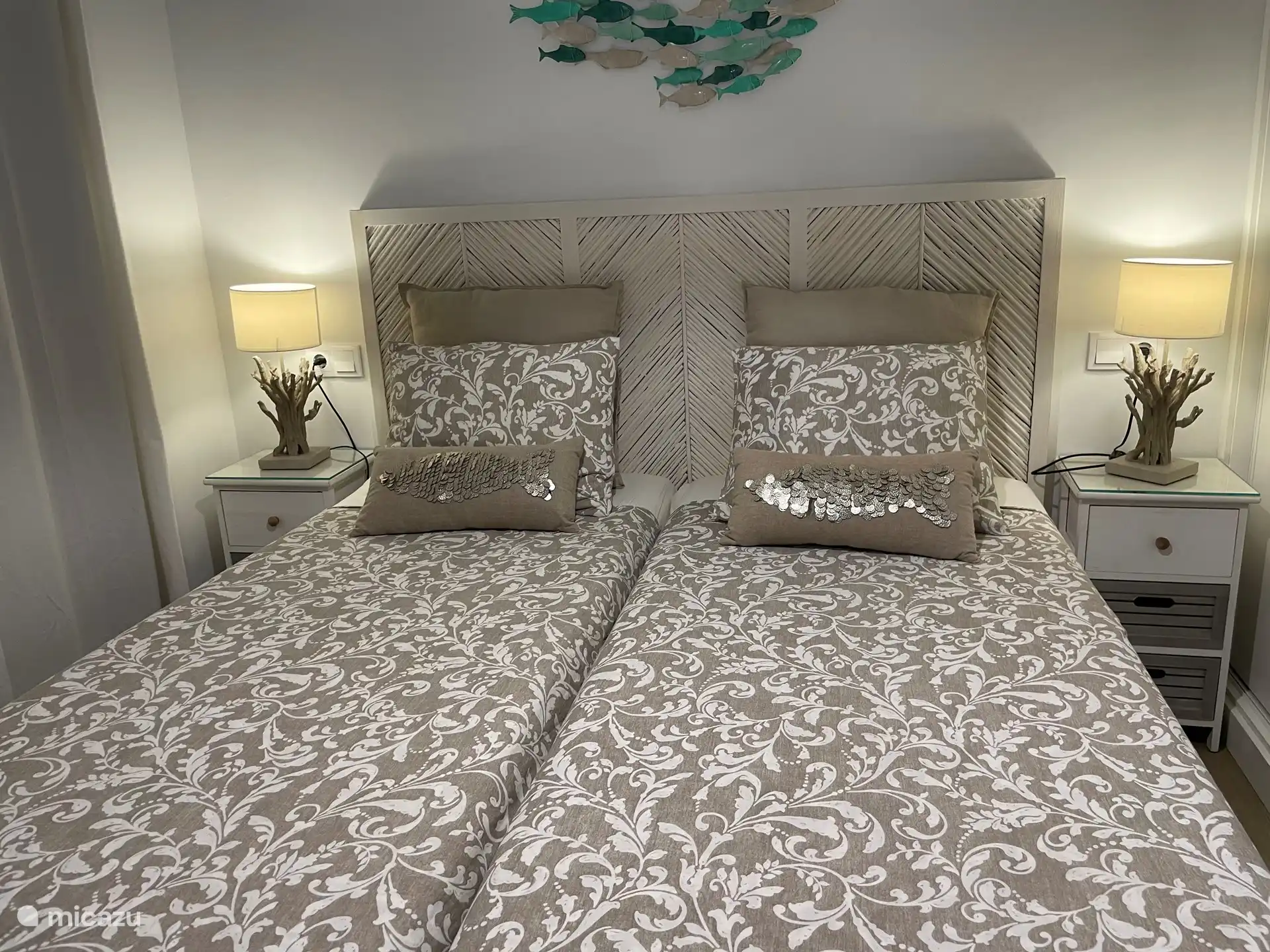 Second bedroom with two beds and built-in wardrobe.