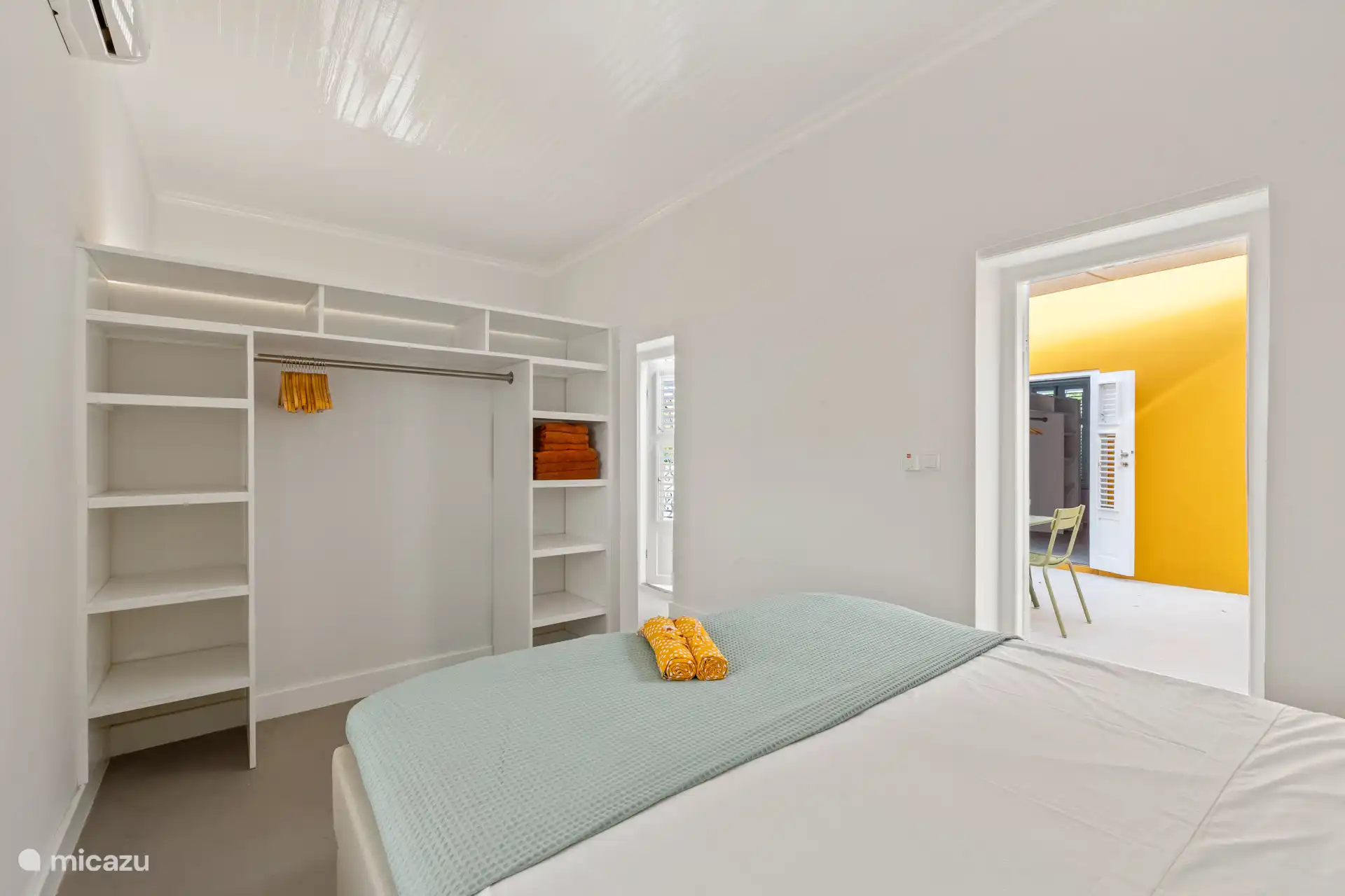 Stylishly furnished bedroom with luxury box spring and wardrobe and located on the patio – an oasis of comfort and tranquility