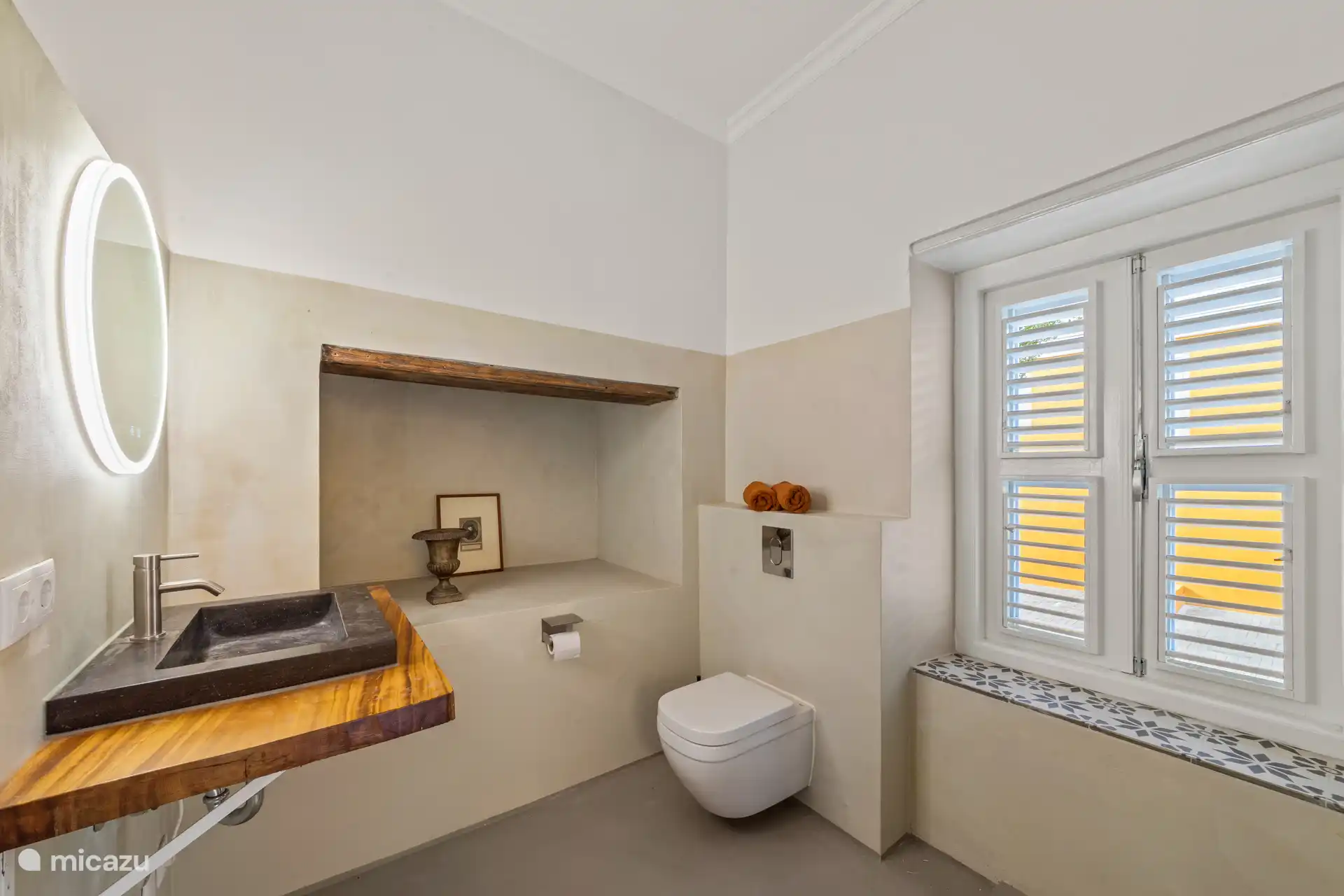 Monumental bathroom with natural stone sink and authentic elements from the old kitchen