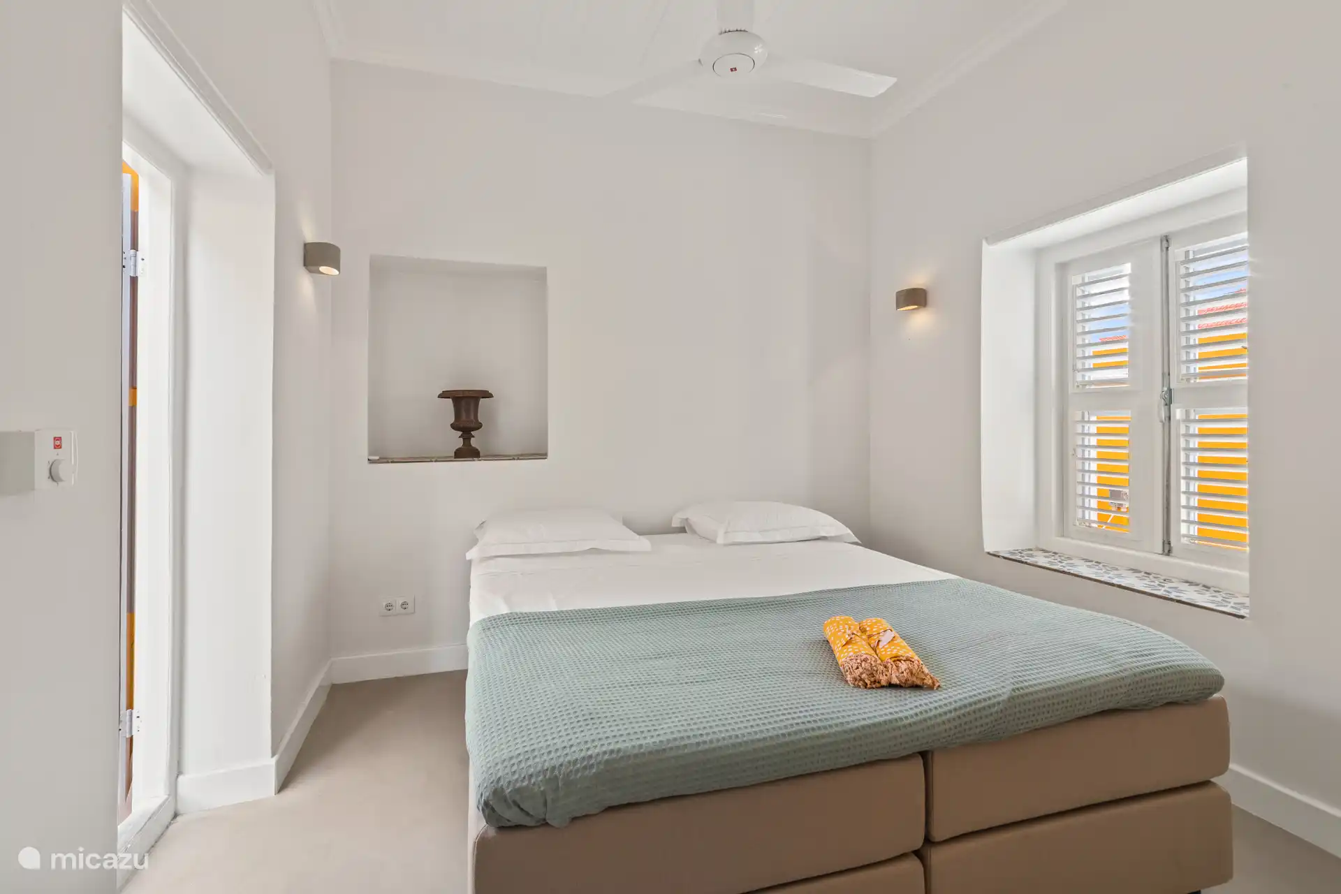 Stylishly furnished bedroom with luxury box spring and wardrobe and located on the patio – an oasis of comfort and tranquility