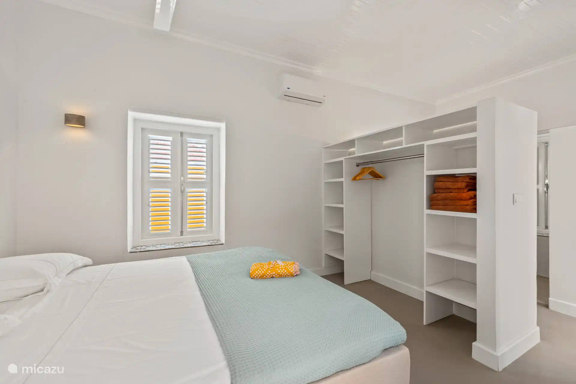 Stylishly furnished bedroom with luxury box spring and wardrobe and located on the patio – an oasis of comfort and tranquility