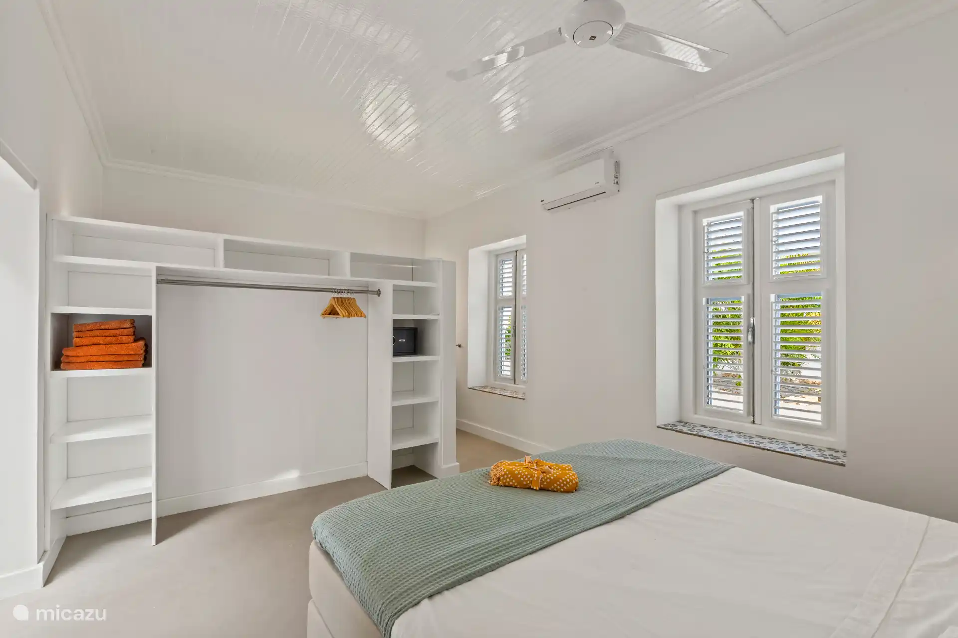 Stylishly furnished bedroom with luxury box spring, wardrobe, safe and garden view – an oasis of comfort and tranquility