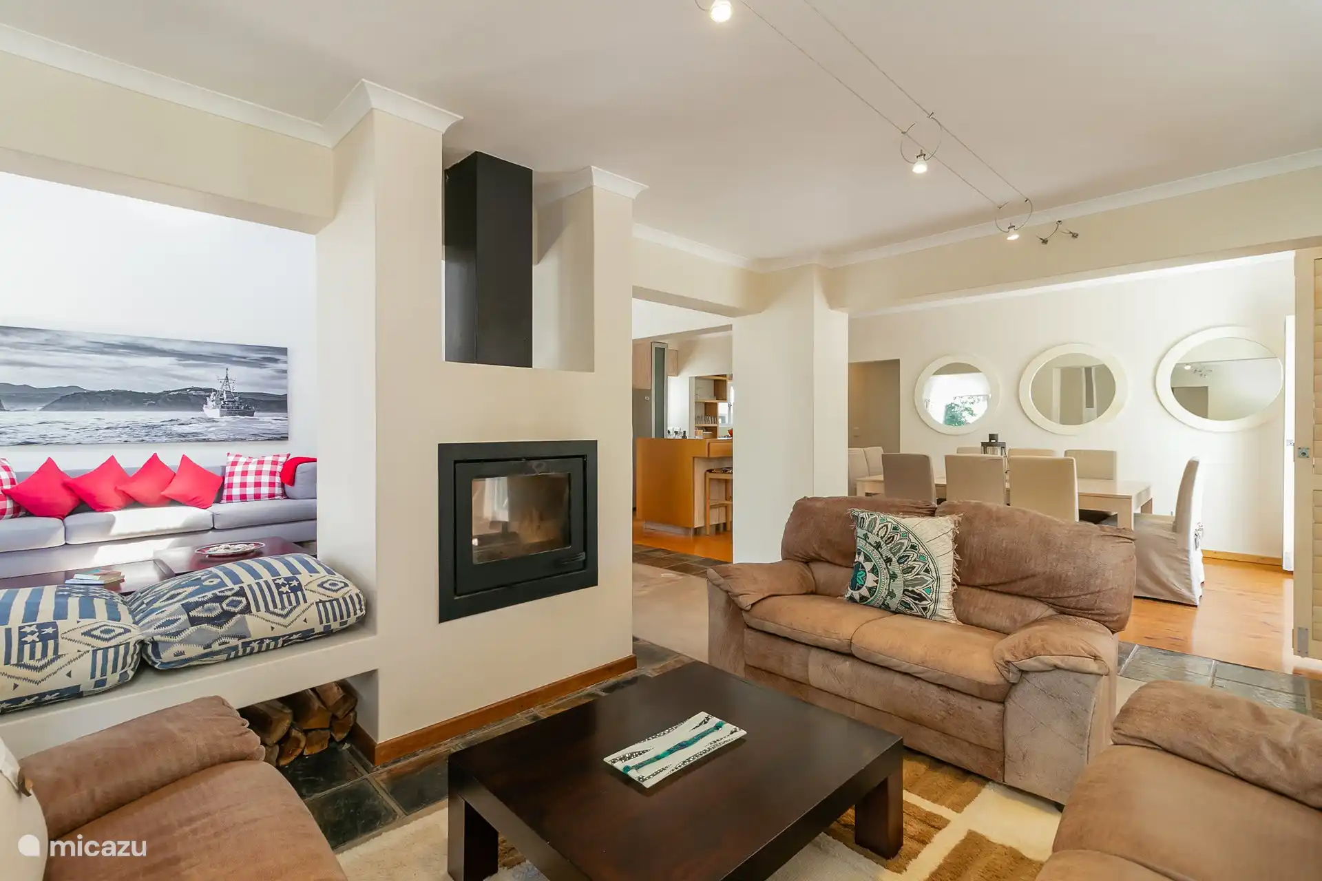 Two lounges with the double fireplace in the middle