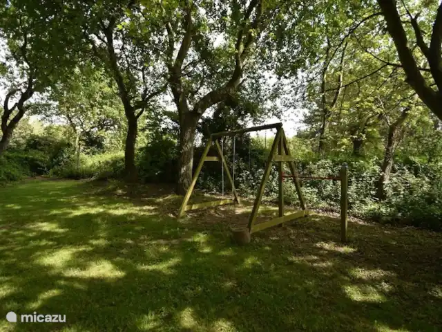 De Den en Países Bajos, Holanda Meridional, Ouddorp - casa vacacional En el jardín hay un parque infantil para los niños.