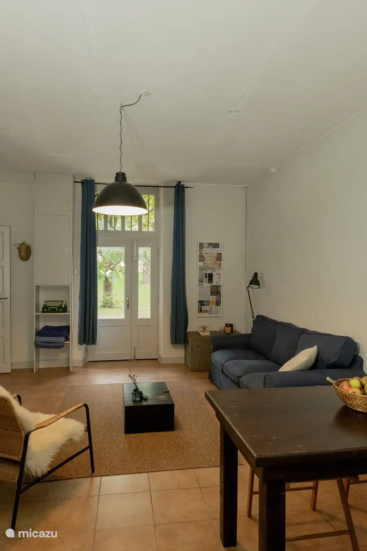 The cozy living room with comfortable sofa and garden view.