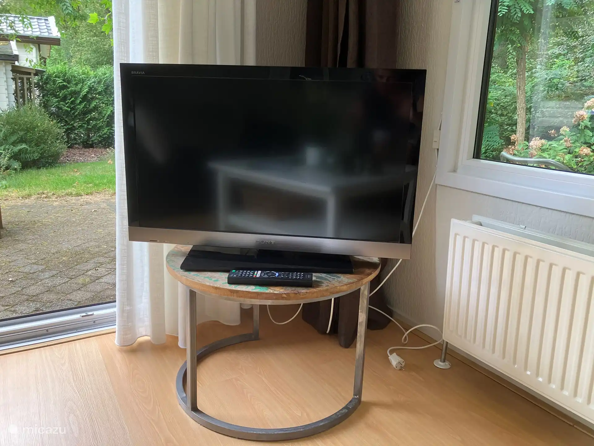 The TV with a clear and easy remote control has a lot of channels in various languages