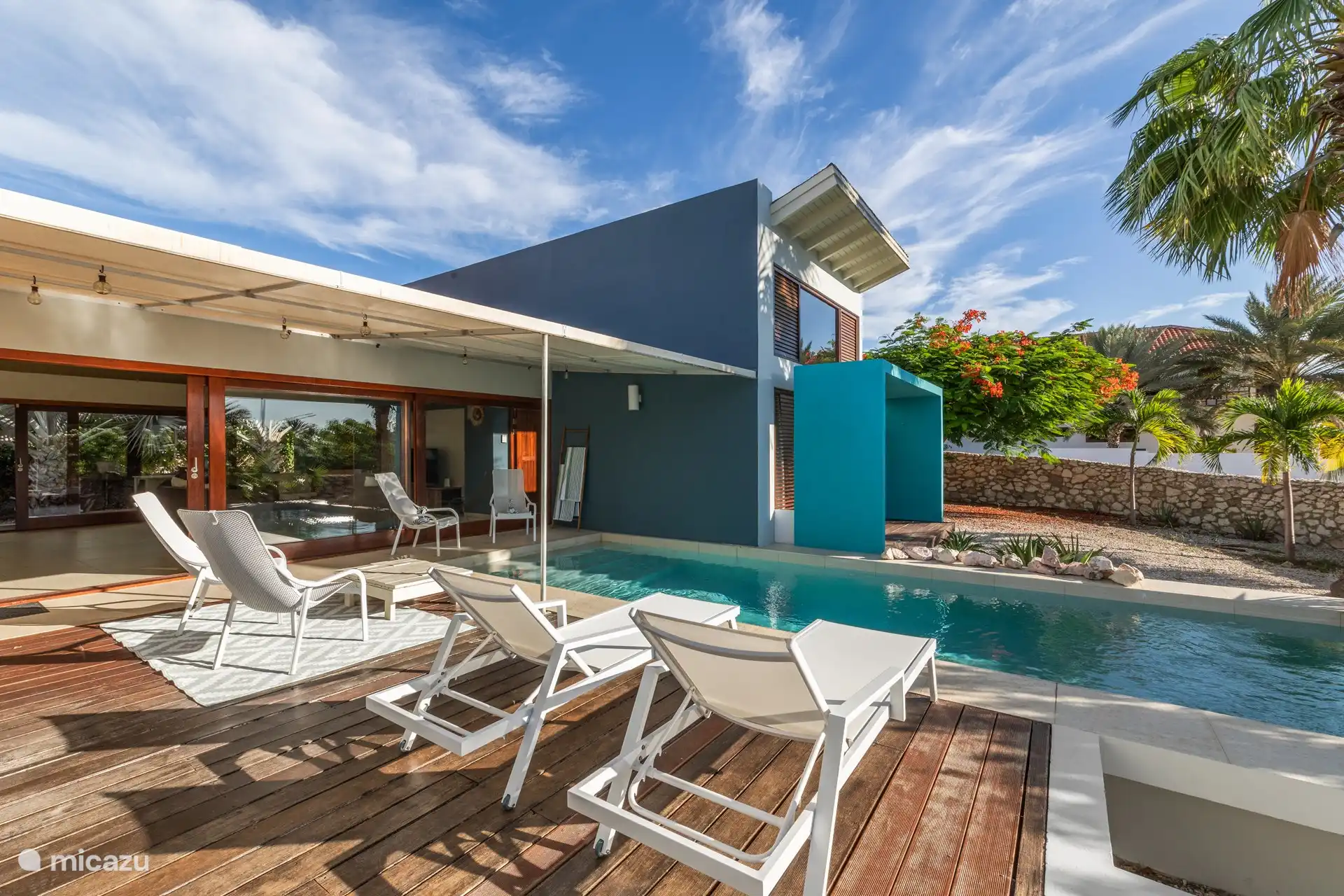 View of swimming pool, entrance villa on the left and blue extension is the master bedroom. 
