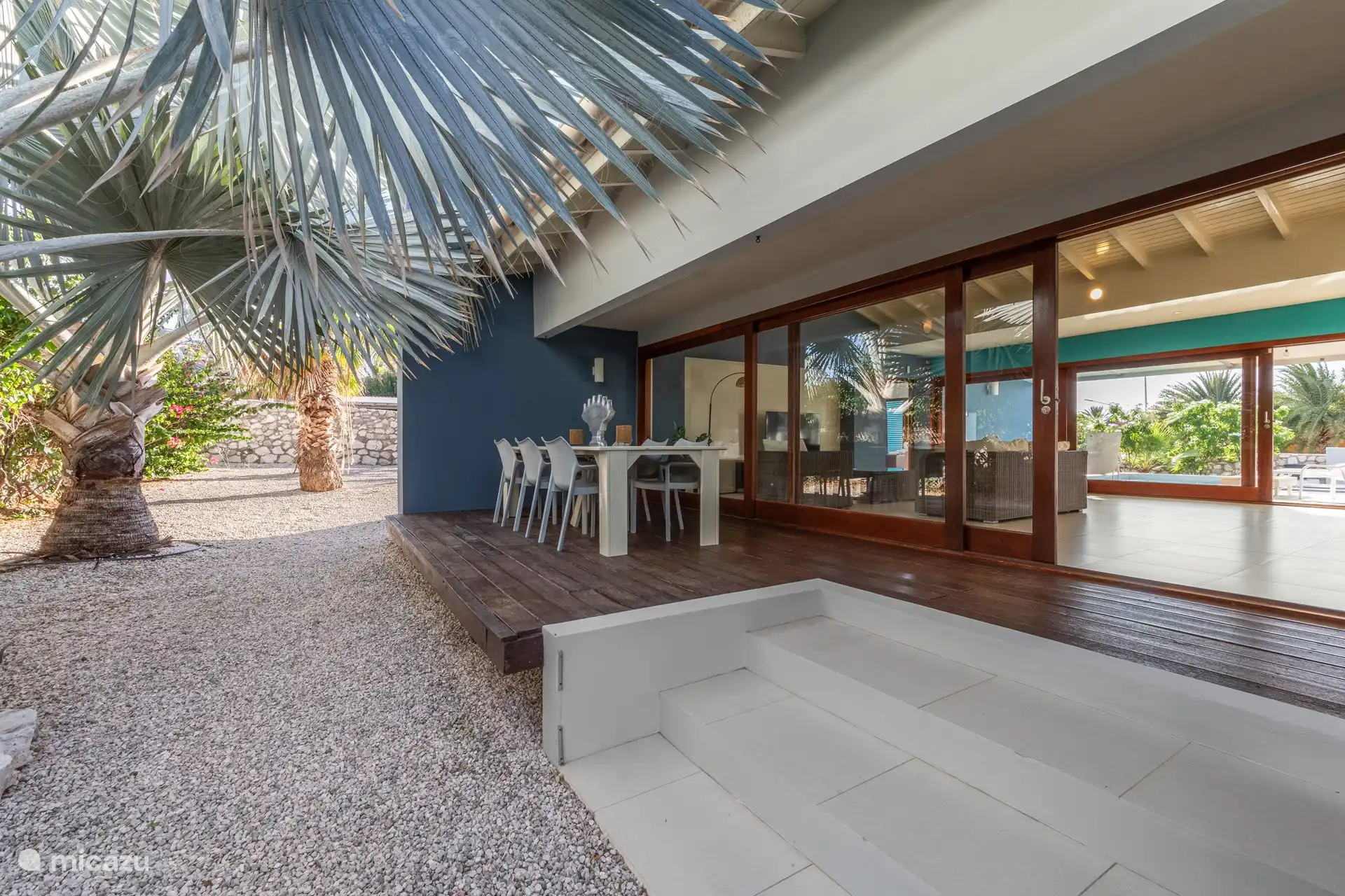 Shaded back porch with dinner table.