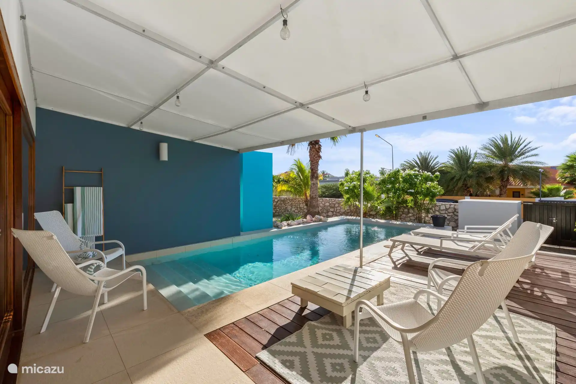 Shaded seating around the pool.