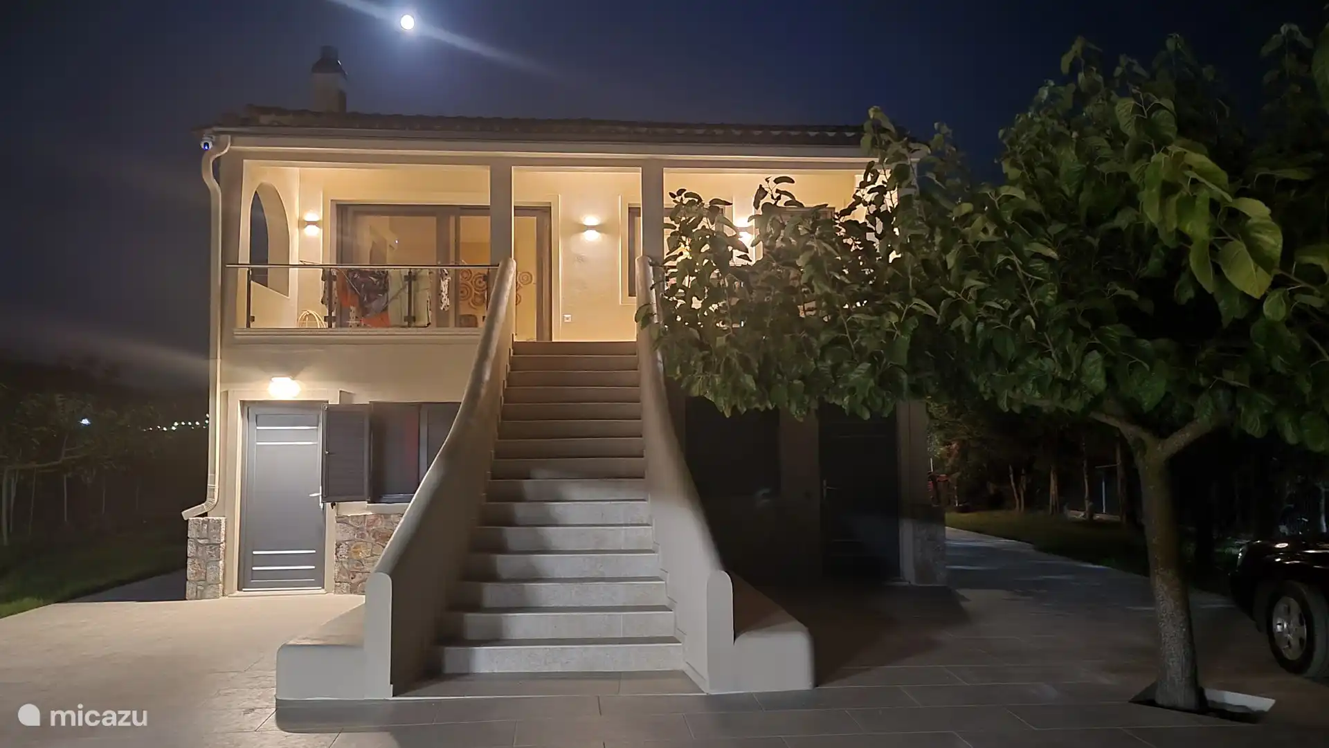 Illuminated villa by night
