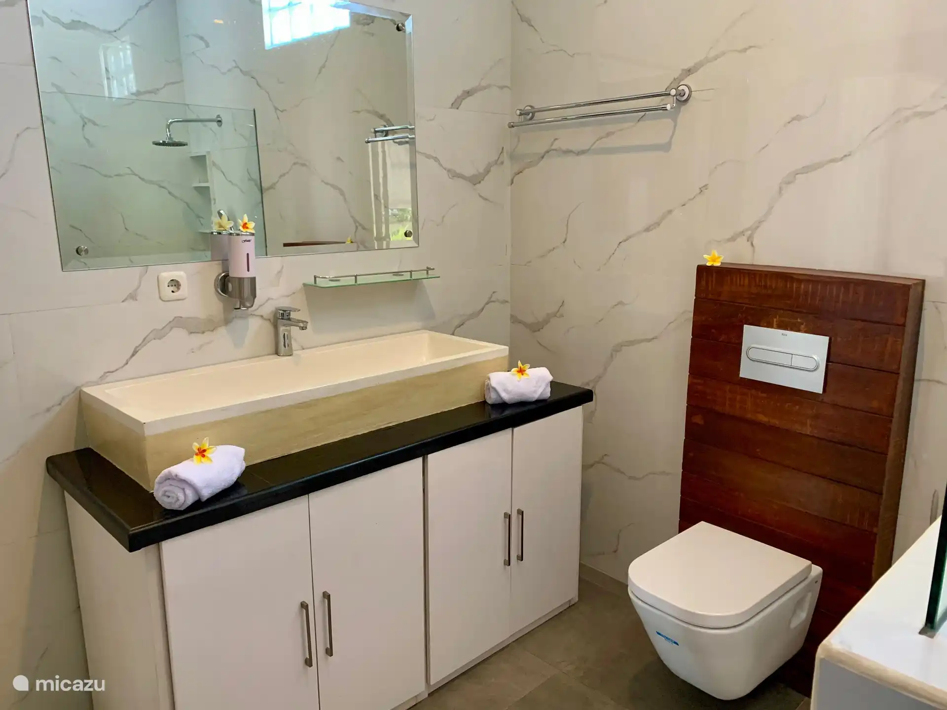 Bathroom 1, all ensuite bathrooms are equipped with toilet, sink and a rain shower.