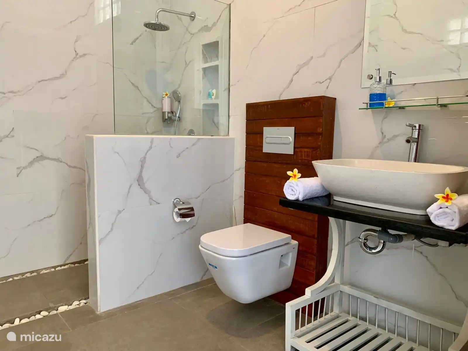 Bathroom 2, all ensuite bathrooms are equipped with toilet, sink and a rain shower.