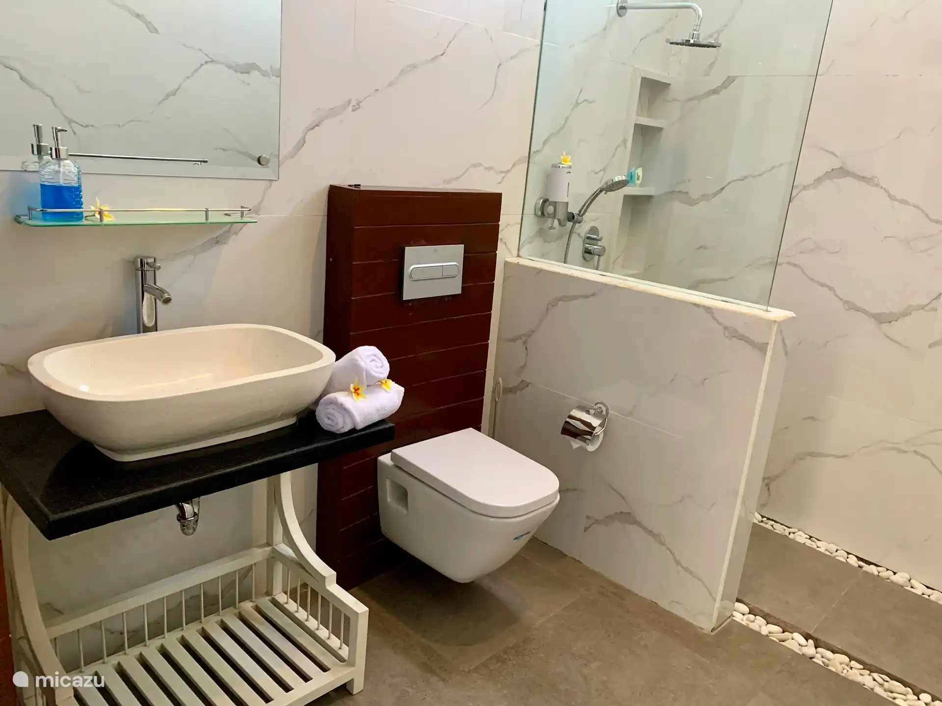 Bathroom 3, all ensuite bathrooms are equipped with toilet, sink and a rain shower.