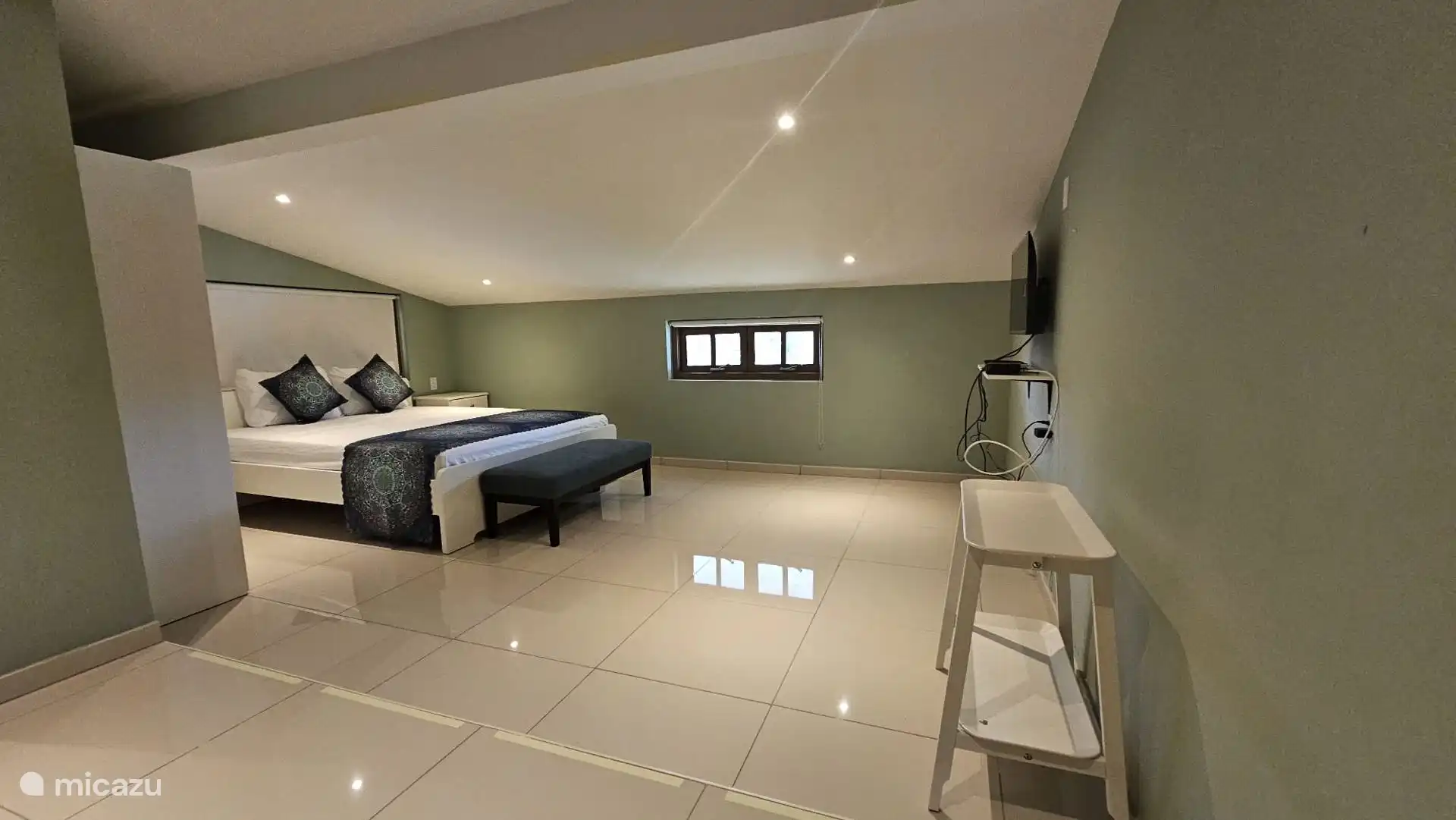 Hoofdslaapkamer met king size bed