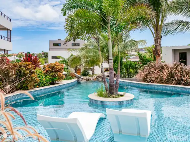 JSLX15 Appartement sur le toit dans le complexe | Curaçao, Banda Ariba (est), Jan Sofat - appartement Piscine avec de jolis transats