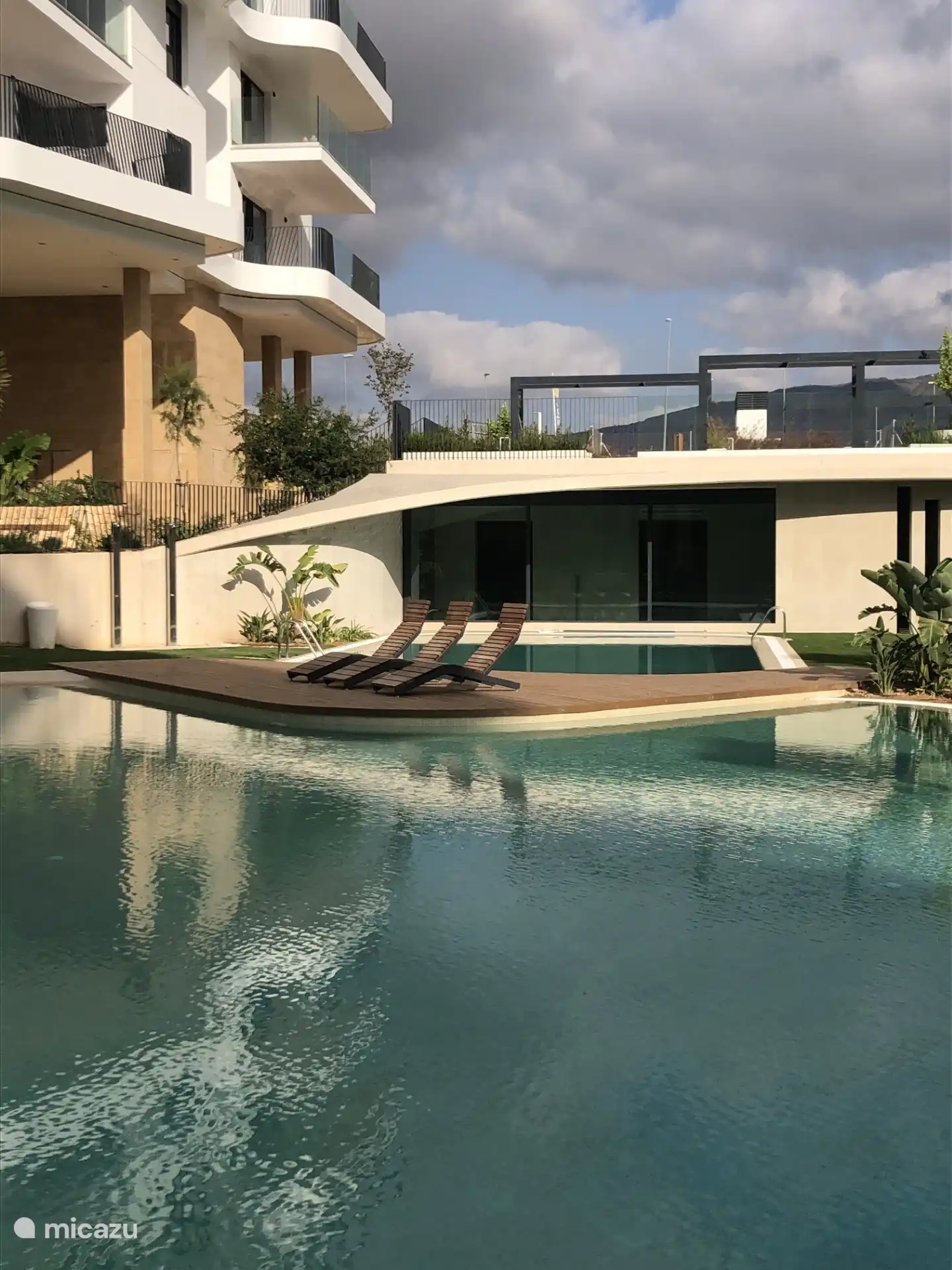 Outdoor Pool Resort with View of Wellness