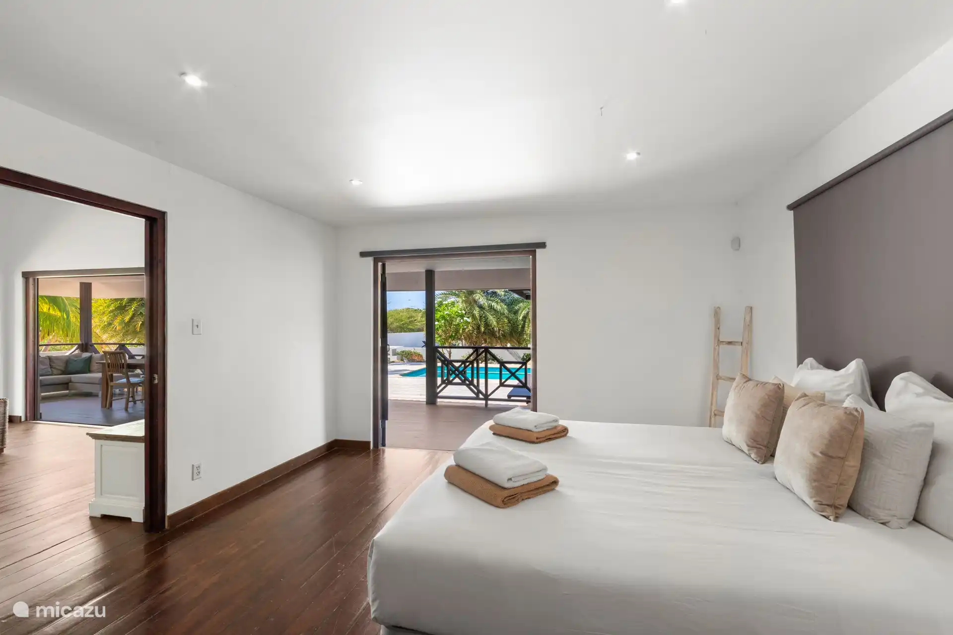 Master bedroom with ensuite bathroom and view to the garden