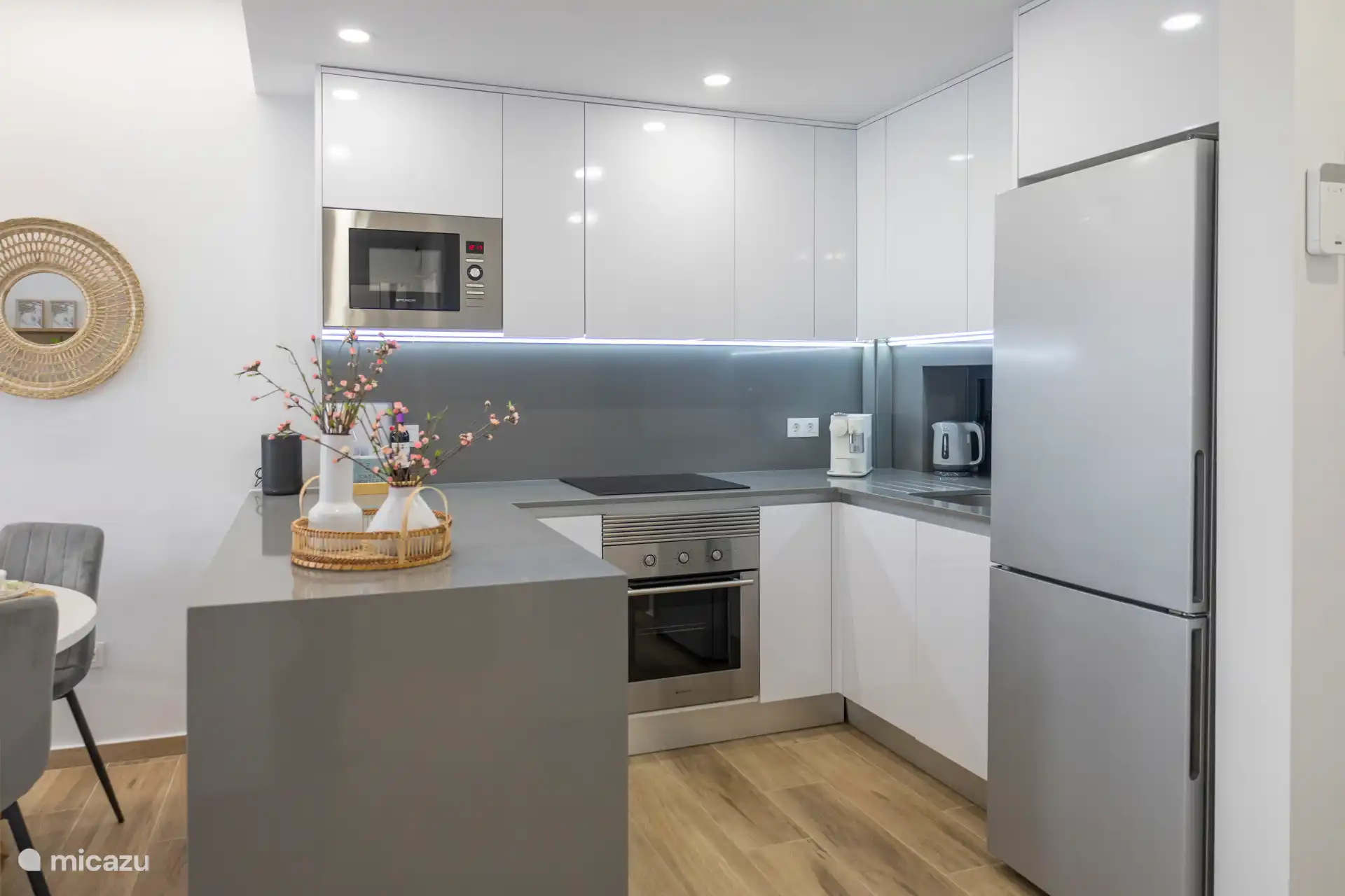 Luxurious open kitchen richly equipped with all appliances.