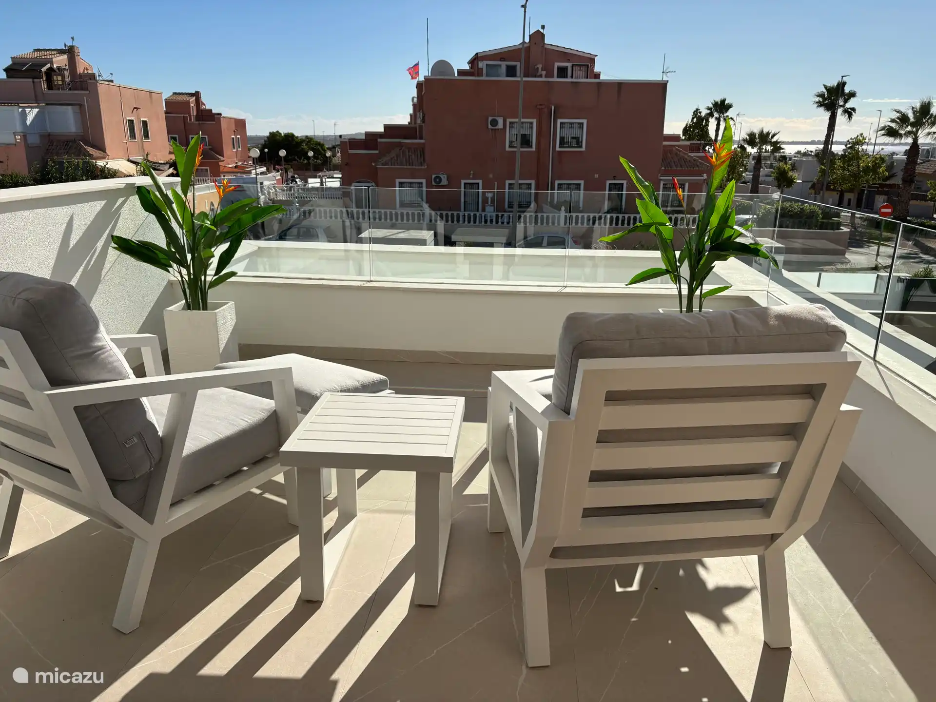 Bedroom with private balcony and salt lake view.