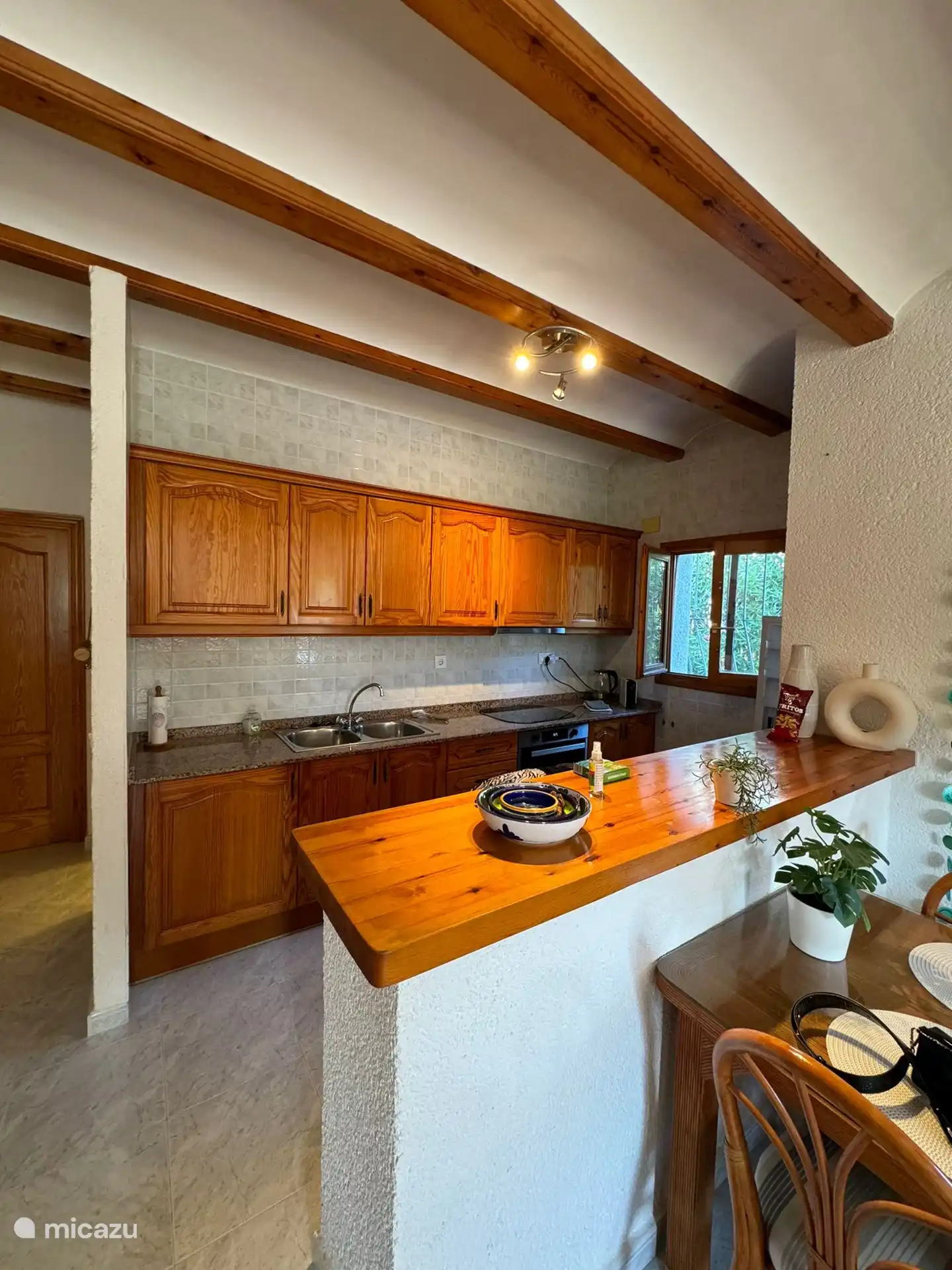 spacious kitchen with oven and fridge and freezer