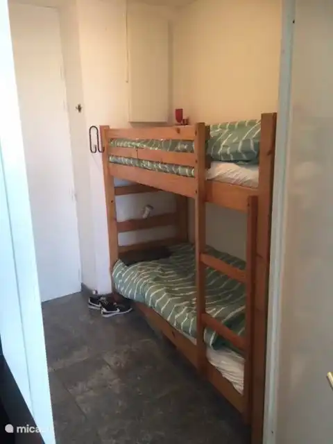 The bunk bed in the alcove in the entrance hall