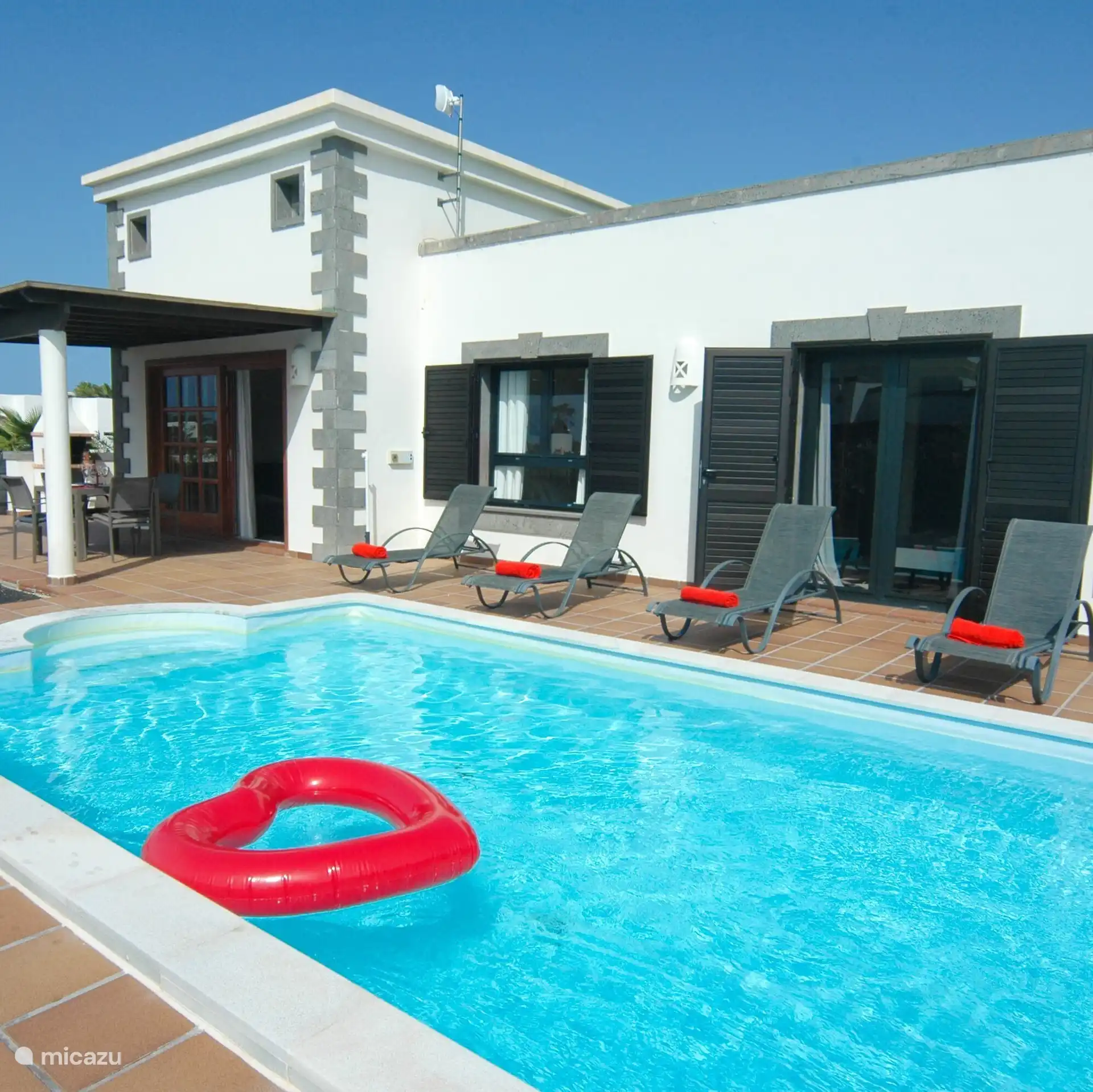 Relax with a good book along your private pool