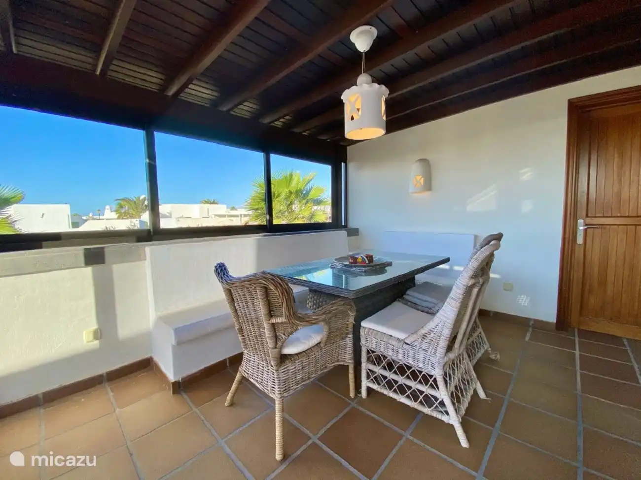 A nice covered dining table with a view