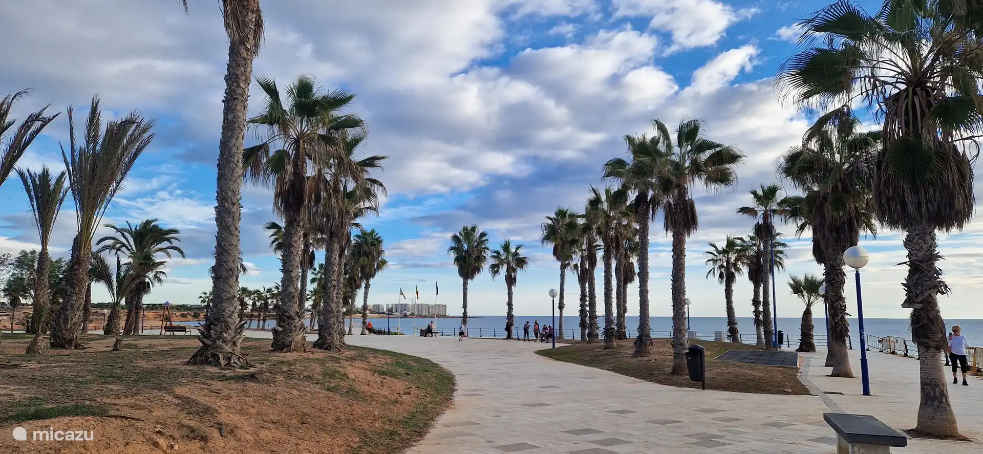 Playa Flamenca, with several terraces on the edge of the square to have a drink and eat.