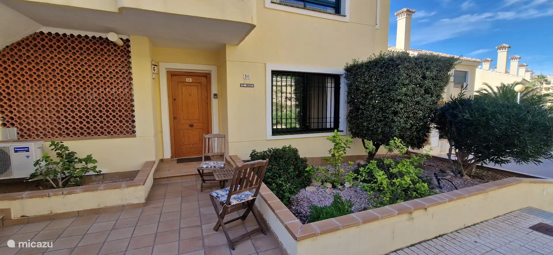 Nice seat to drink a cup of coffee in the morning in the spring and in the summer you can sit here in the shade in the afternoon.