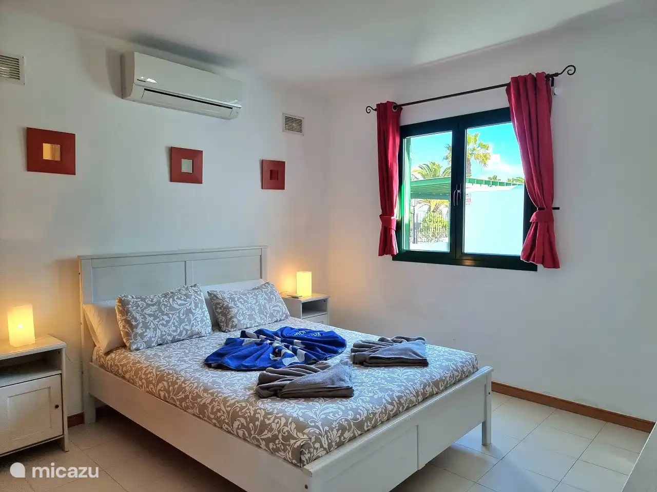 Bedroom 1 with double bed, air conditioning and plenty of comfort.
